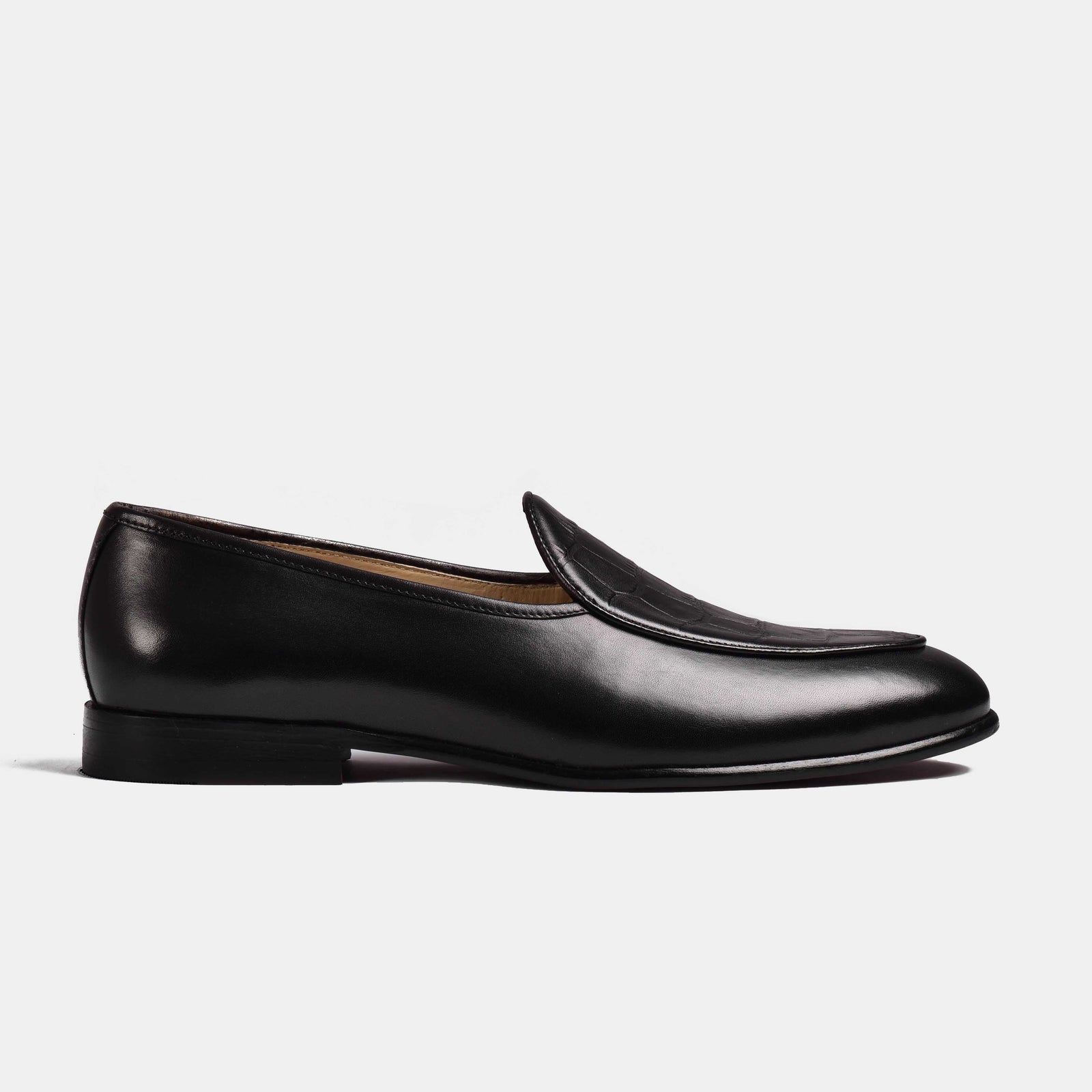 A pair of black patina Arno Loafers with a textured leather vamp.