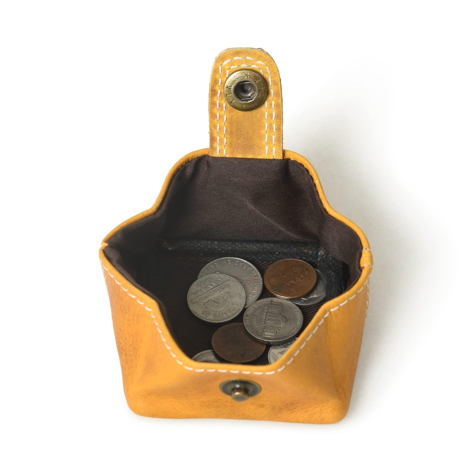 Open mustard-colored mini pocket wallet made with full grain leather, showing interior coin pouch and snap closure.