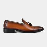 Side view of Vincenz Tan Leather Loafers, featuring a tan leather upper with brogue detailing and a tassel accent.