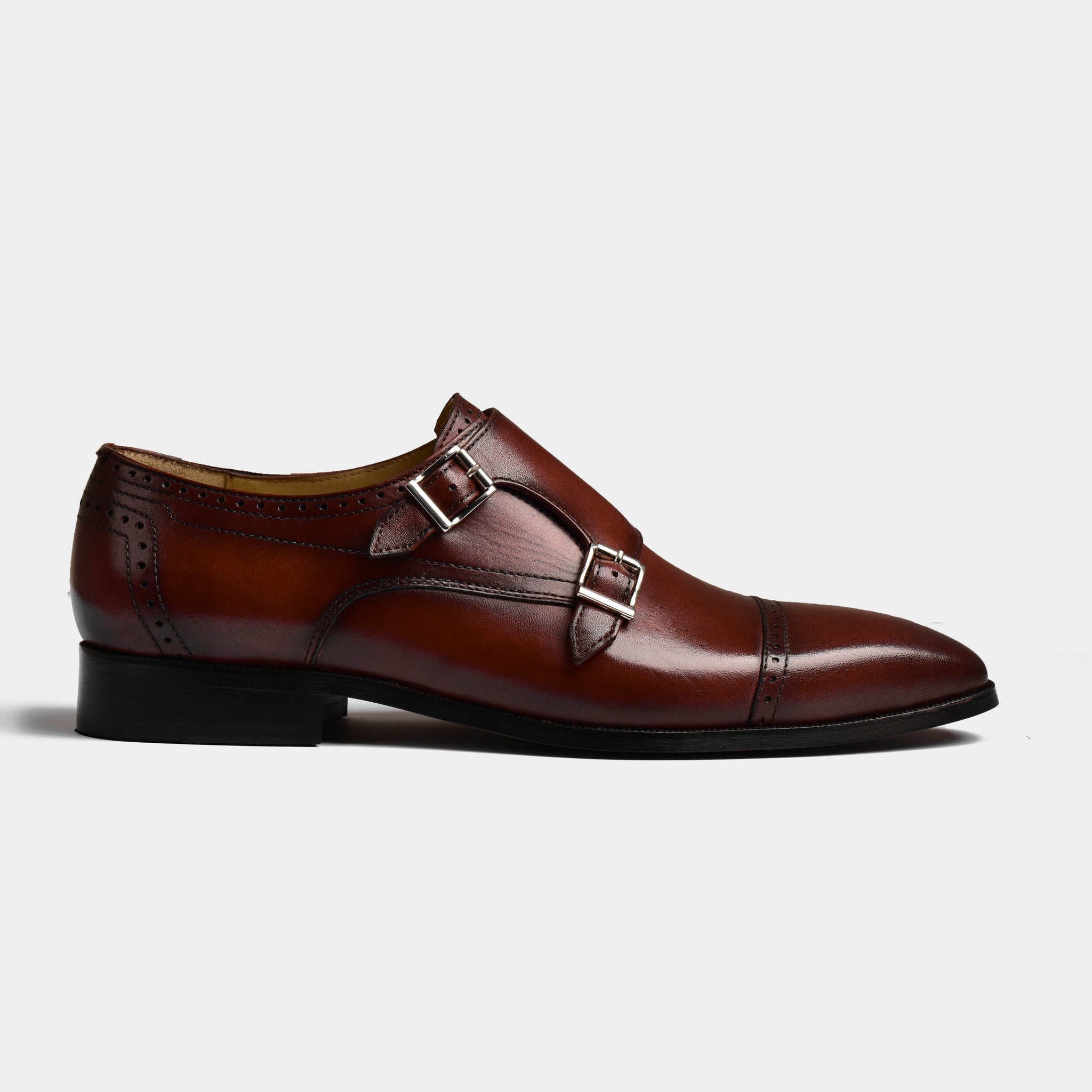 Side view of a brown Viento Cognac Leather Monk Strap shoe, featuring double buckle straps and a classic brogue toe design.