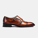 A side view of Henry Tan Double Leather Monk Straps in brown leather, featuring double monk straps and brogue detailing.