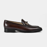 Adelmo obsidian brown leather loafers with a gold buckle accent, shown in a side view.