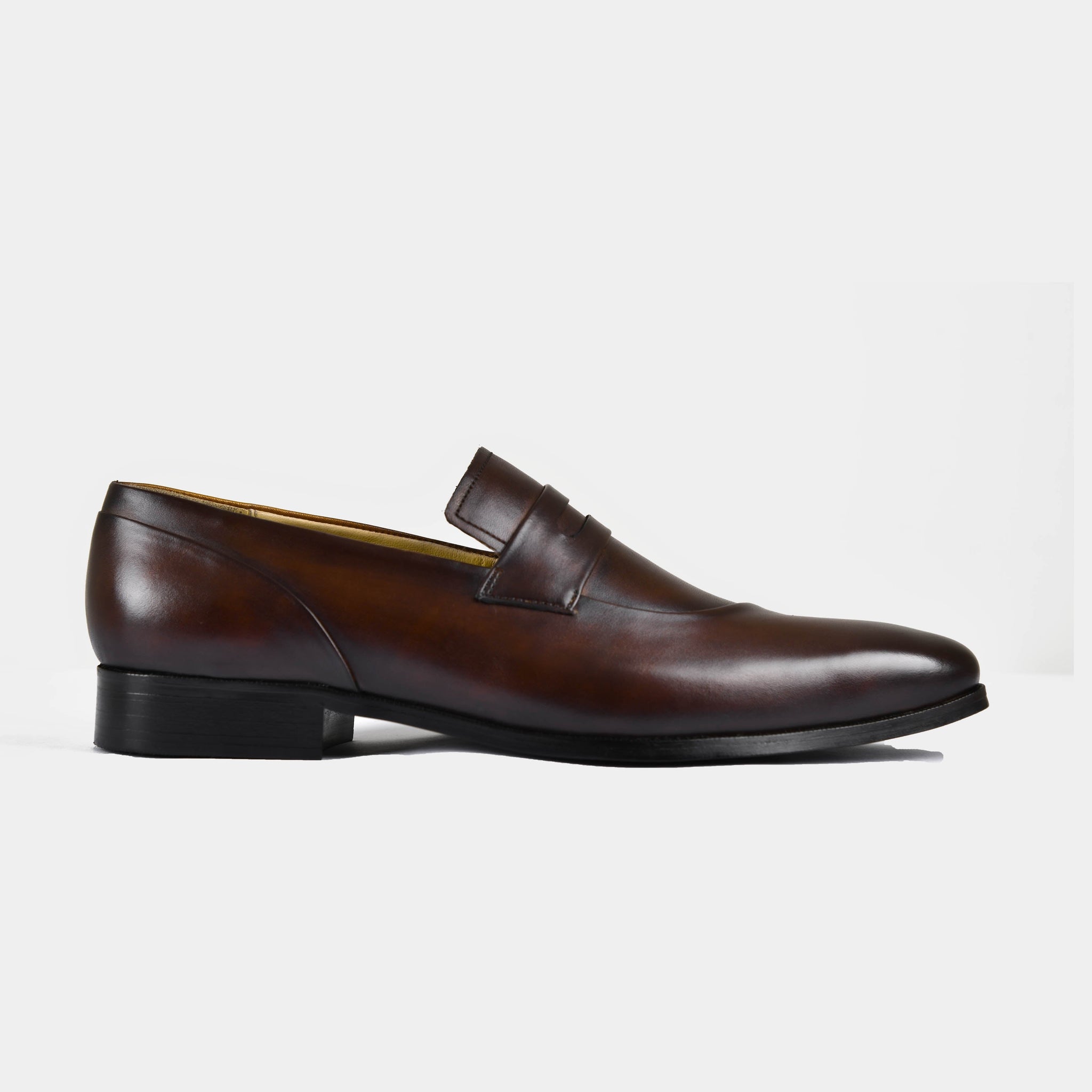 A pair of Laredo Brown Leather Loafers on a white background.