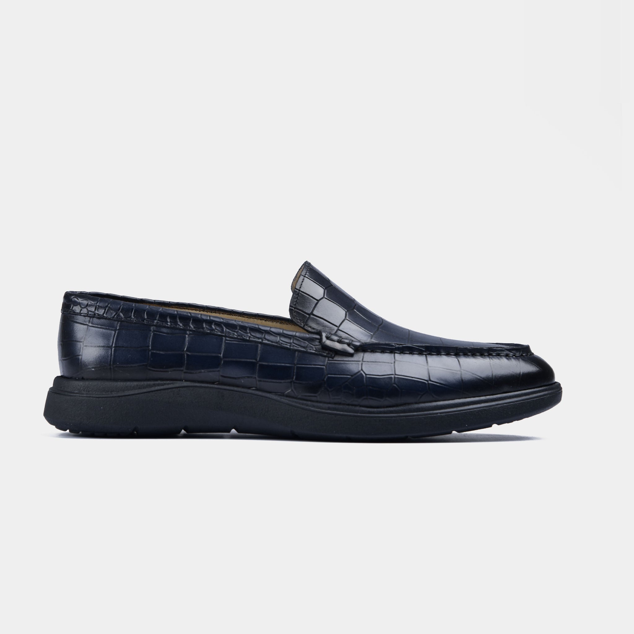 Pair of navy blue croc leather slip-on shoes with a flexible black sole.