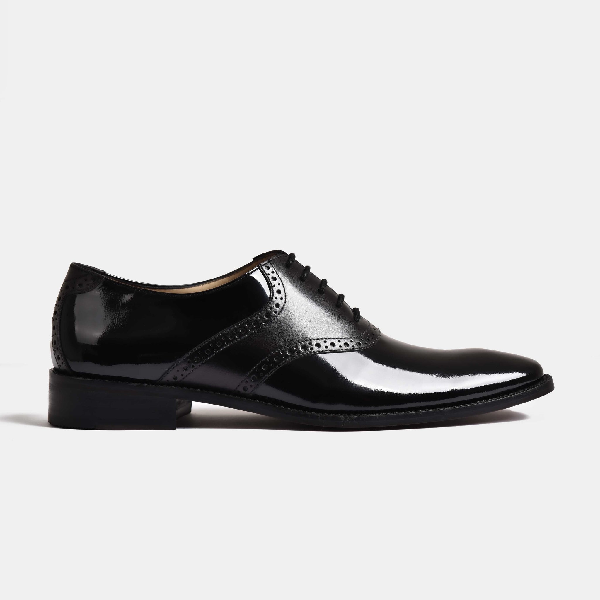 A pair of David Aniston Leather Laceups in black, featuring a polished finish and classic brogue detailing.