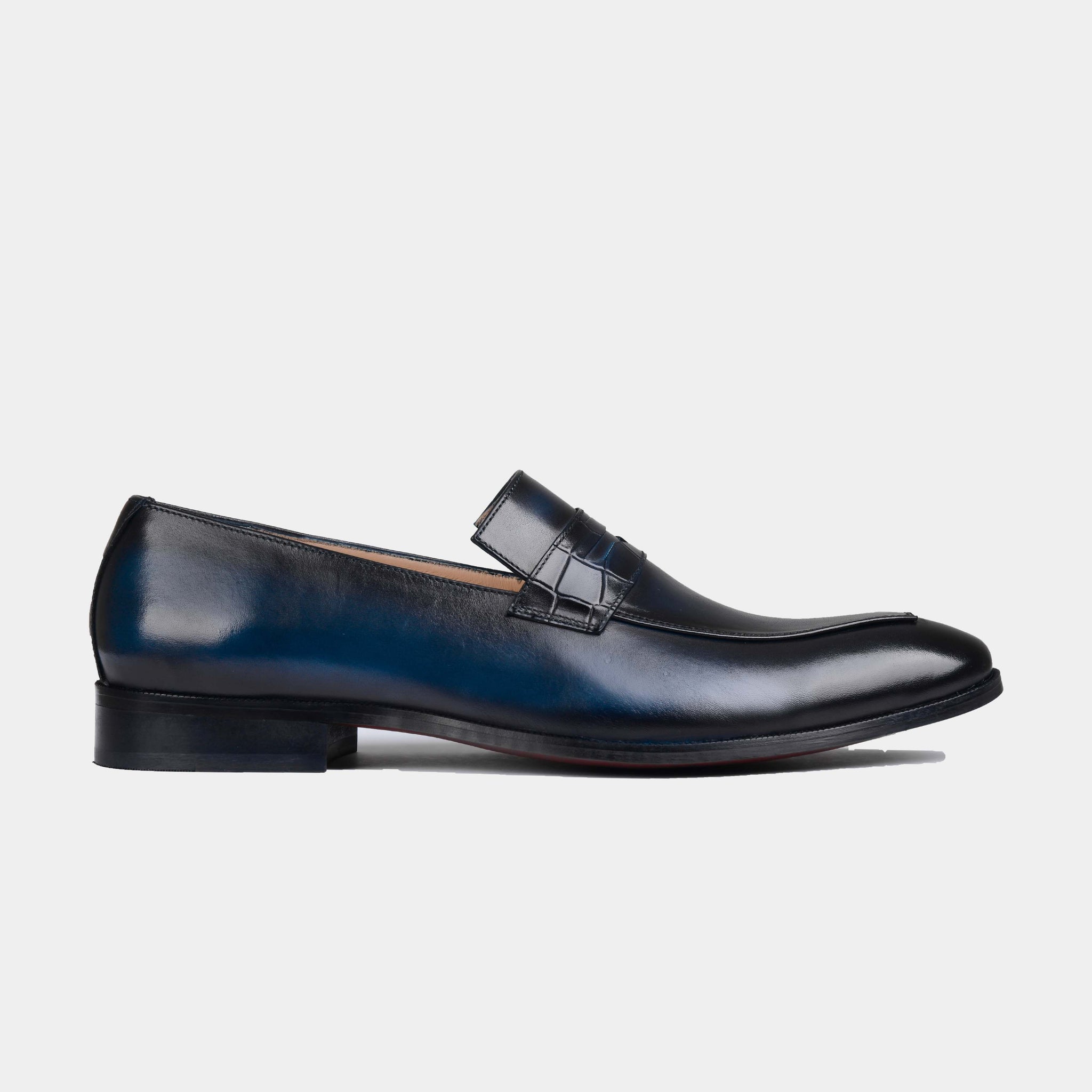 Pair of Lucero Blue Leather Loafers in a rich blue shade, featuring a classic penny loafer design.