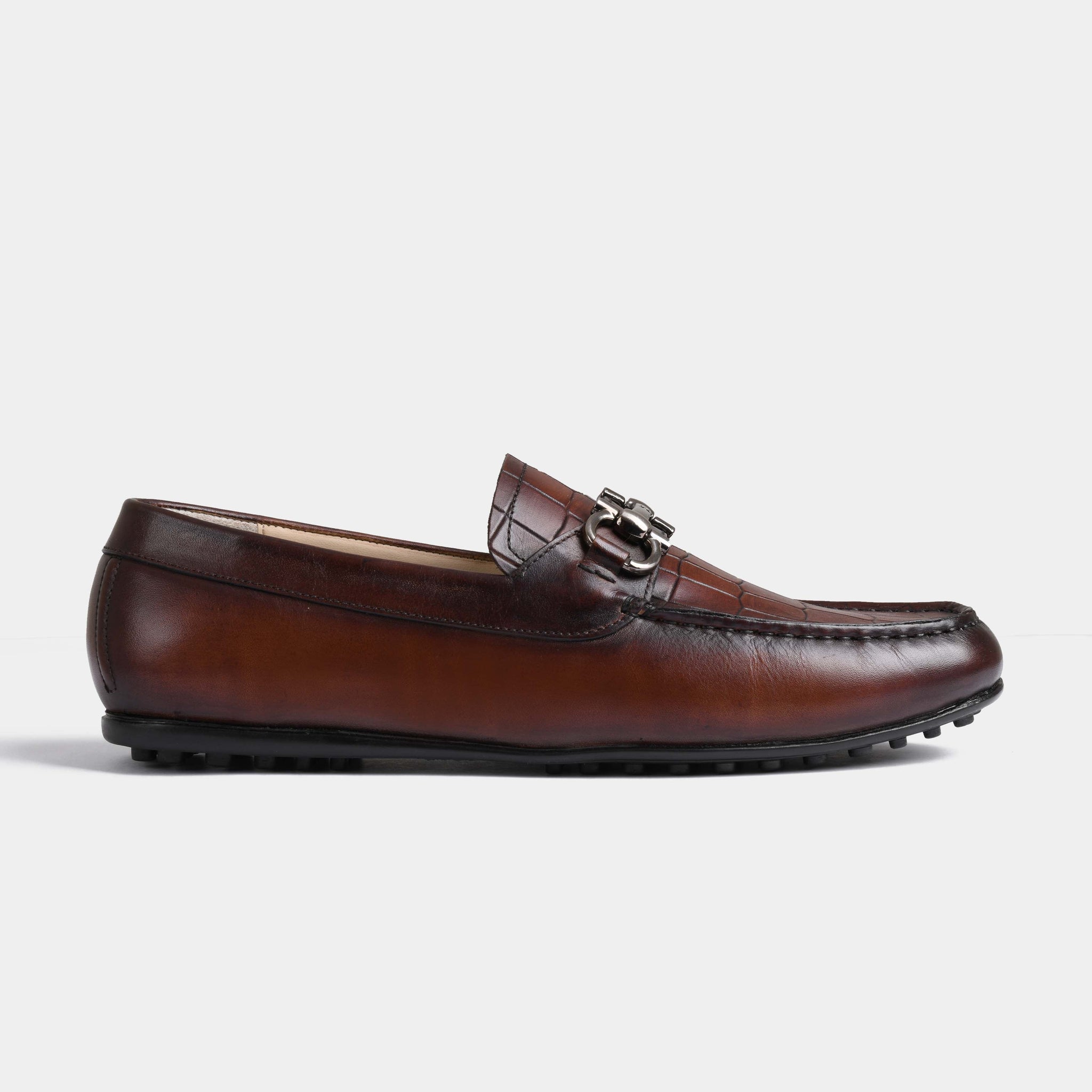 Side view of Alonzo Mid-Brown Leather Driving Loafers with a stylish metal accent.