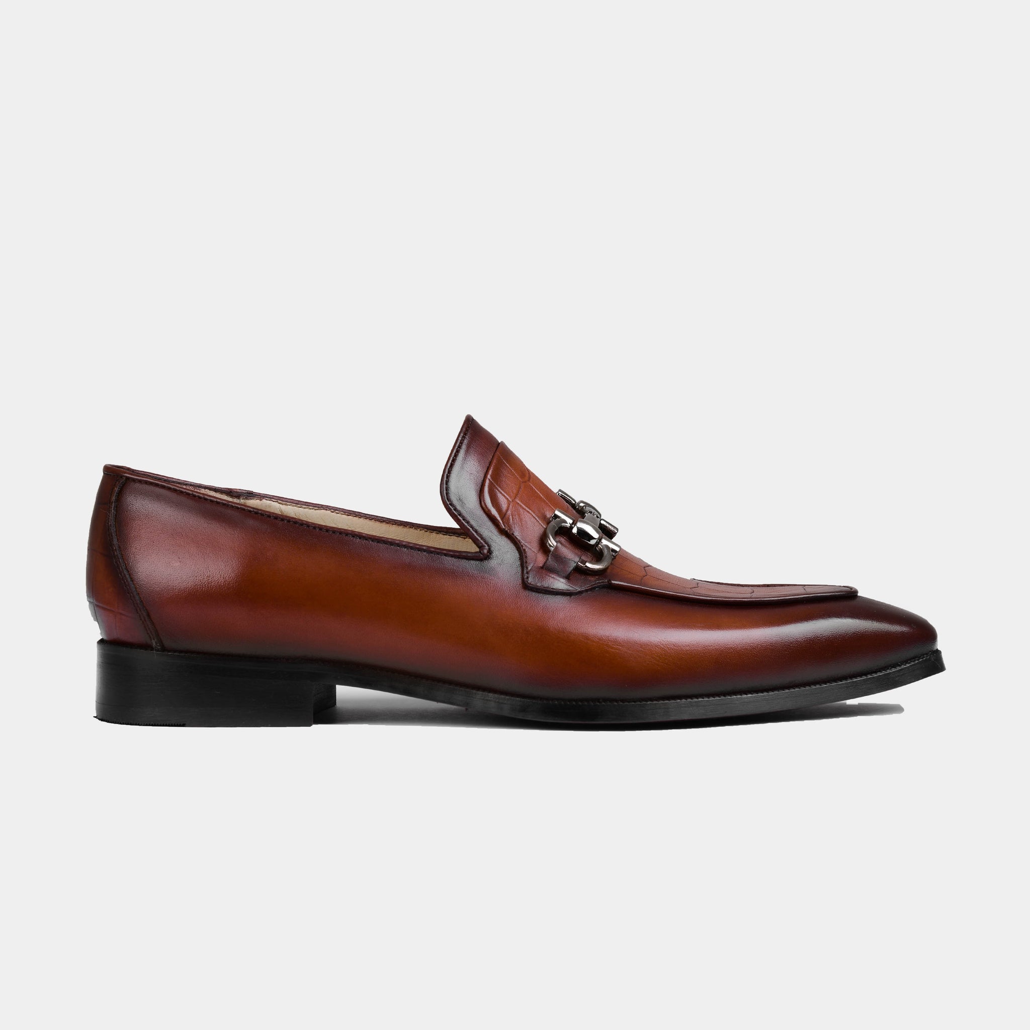 A pair of men's brown Gior cognac leather loafers with a brushed metal trim detail.