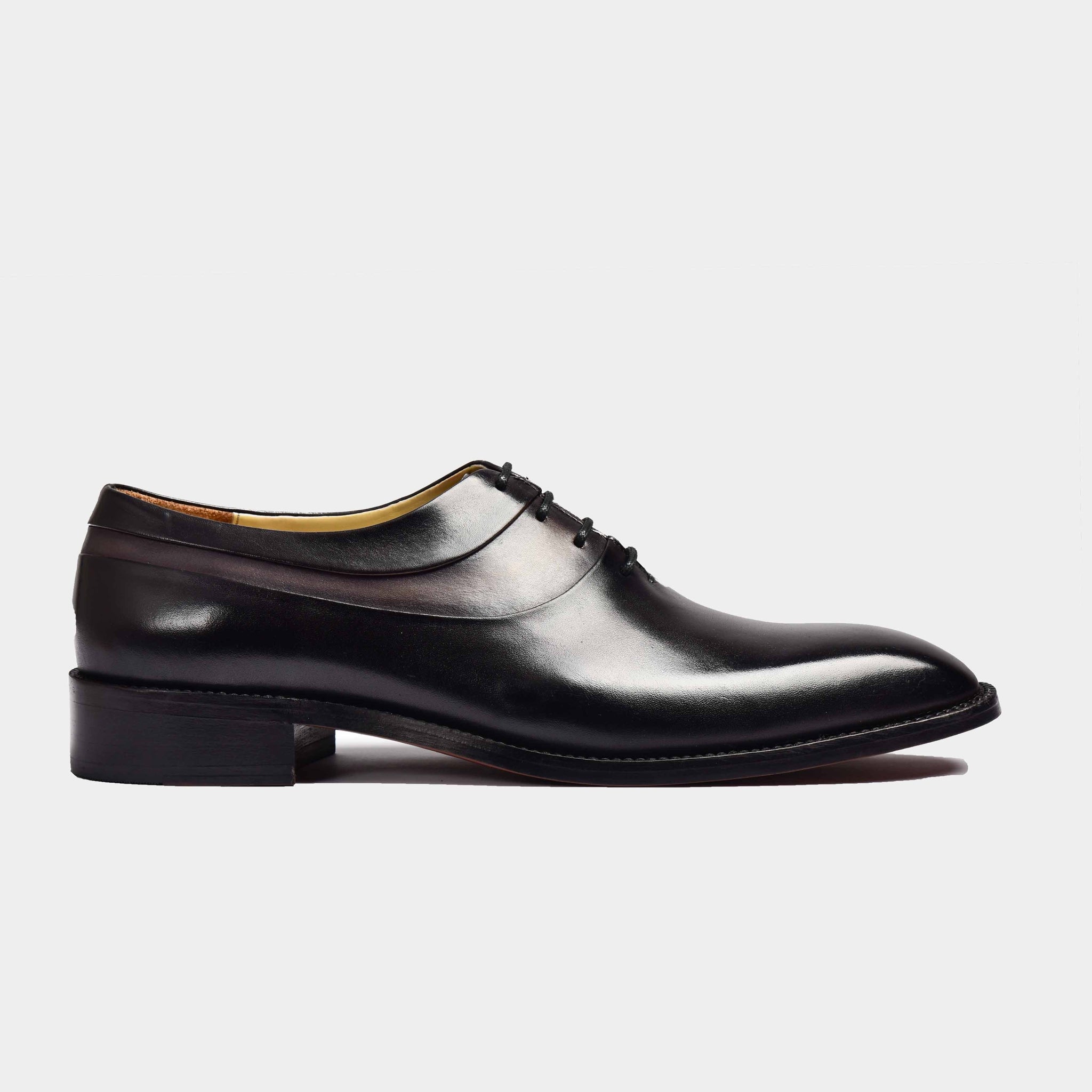 Side view of Arlo Noir Leather Laceups, stylish black leather dress shoes with a classic lace-up design.