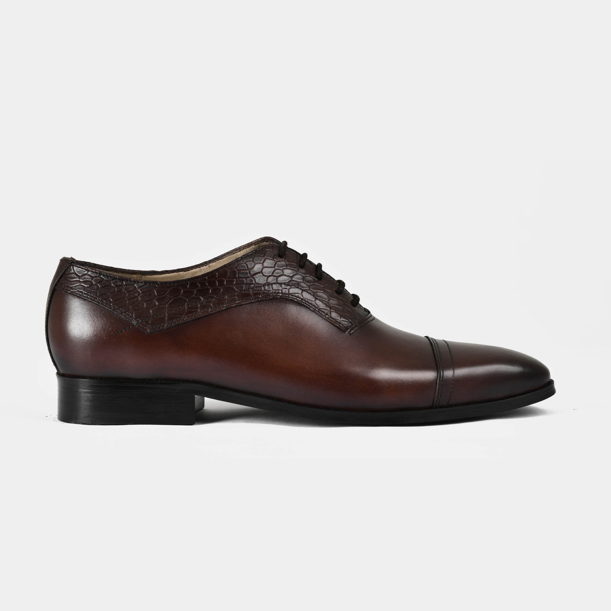 Elvio croc brown leather lace-up dress shoe with a side view on a white background.