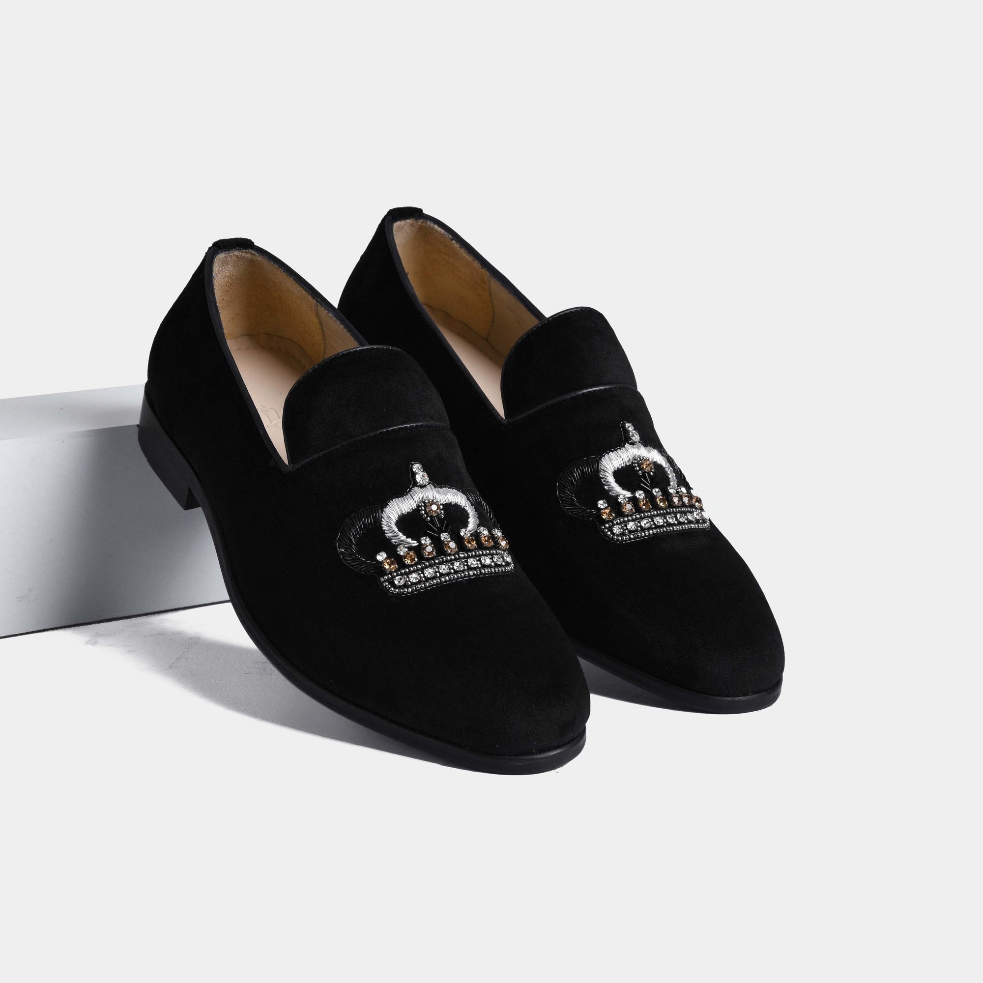 Pair of Luciano Black Embroidered Leather Slip-Ons with embroidered jeweled crown detail on black suede.