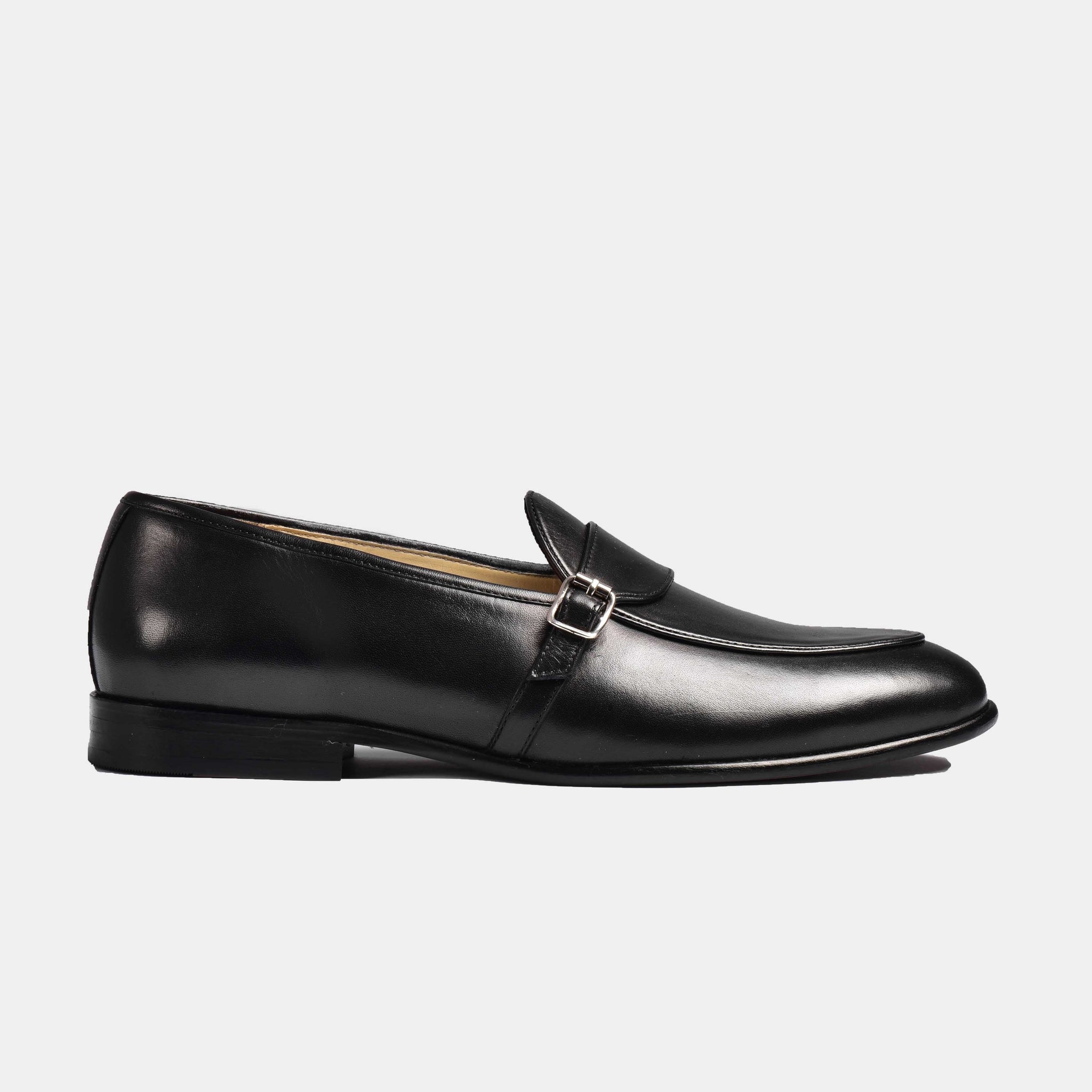 Black patina leather Arno Loafers with a single strap and buckle detail.