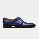 A pair of blue Michael Niel Leather Monk Straps with silver buckles on a white background.