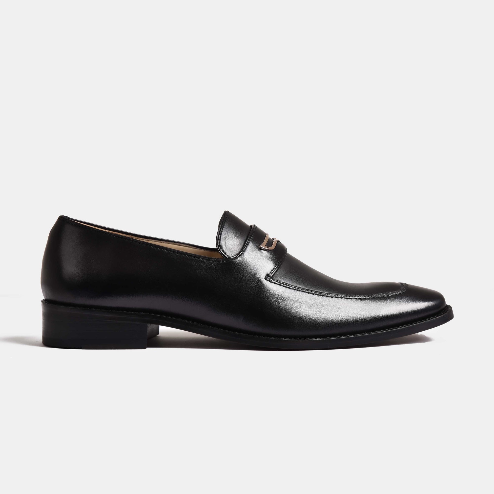 A pair of sleek black leather Jack Black Penny Loafers with a silver trim detail, shown from the side.