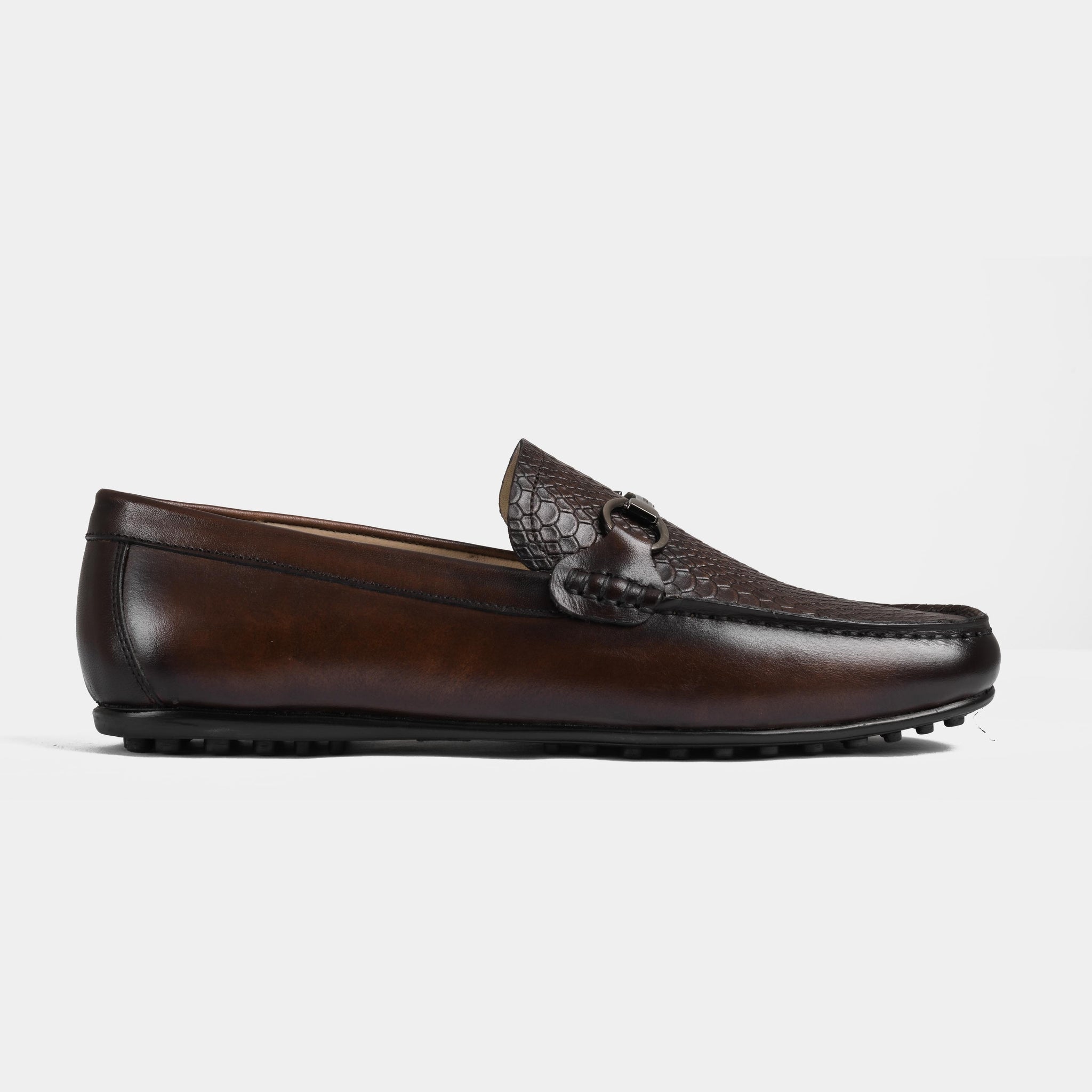 Pair of Matias Brown Leather Driving Loafers with a textured vamp and metal accent.