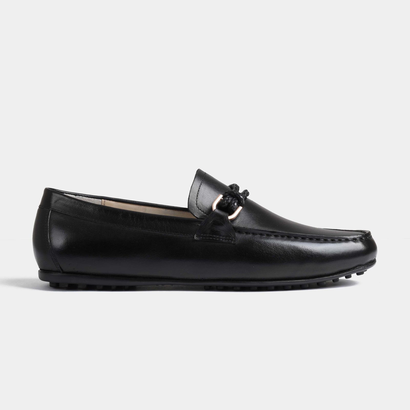 Pair of Pablo Black Leather Driving Loafers with a braided strap and metal accent.