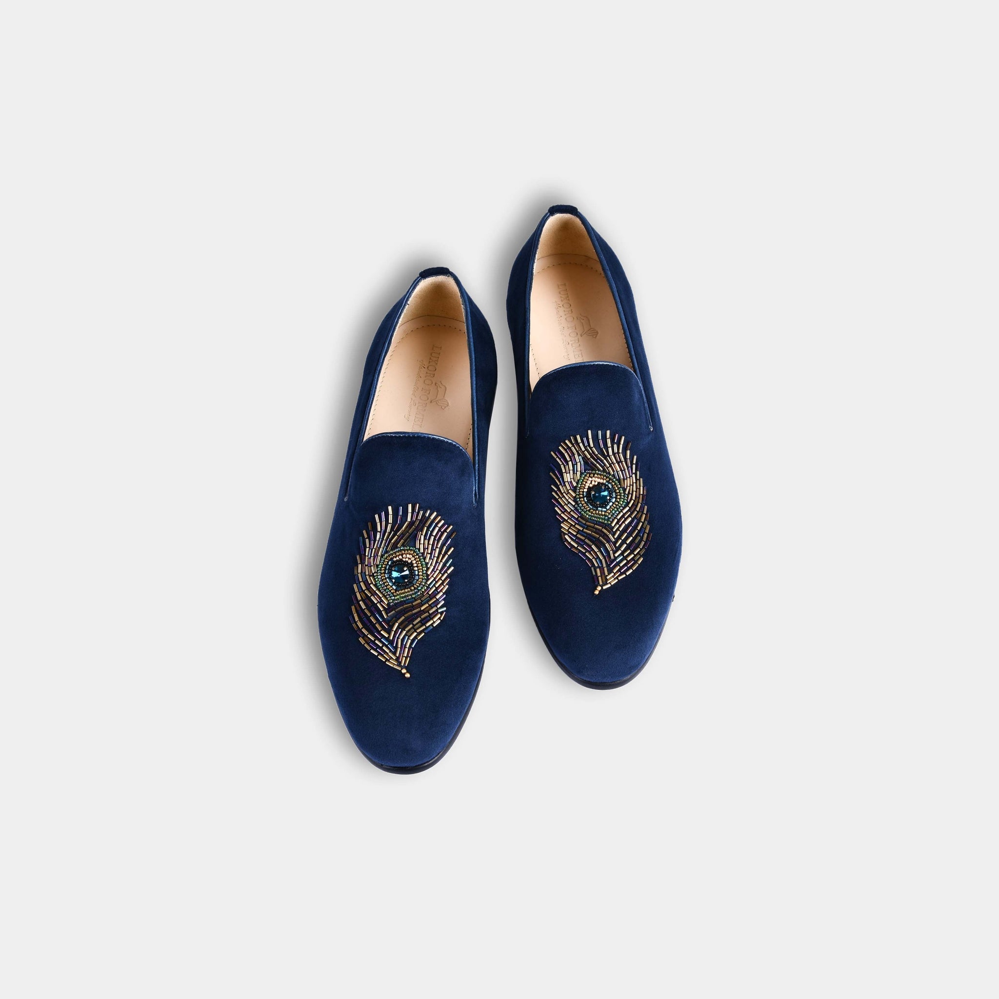 Pair of Artemio Blue Embroidered Leather Slip-Ons, featuring a striking peacock feather design with intricate beading.