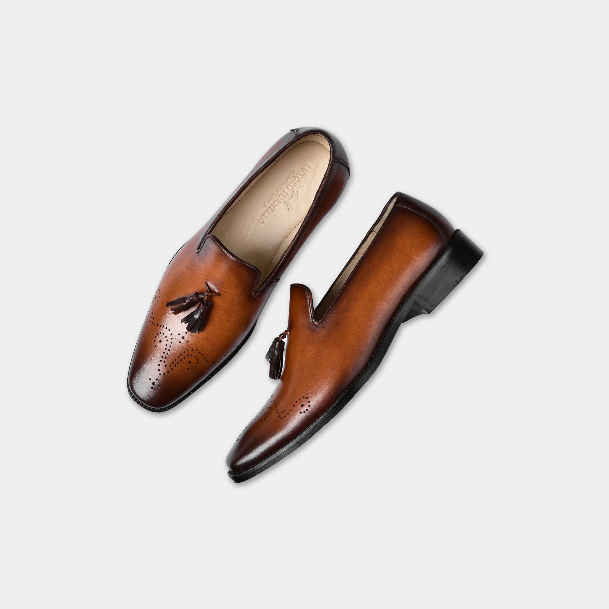 Pair of Vincenz Tan Leather Loafers with tassels and brogue detailing.