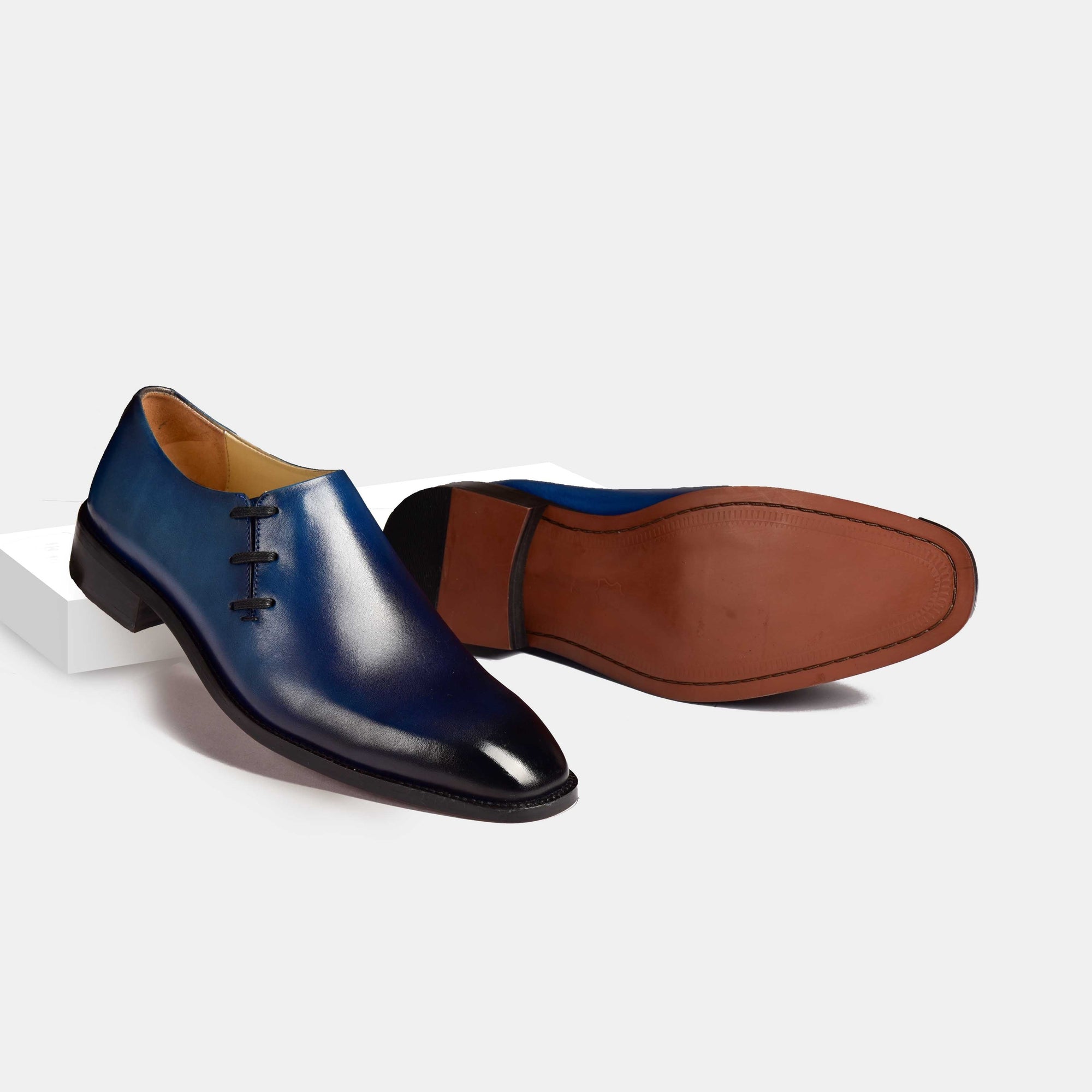 Pair of Oliver Blue Side Laceup Leather Laceups, a stylish blue leather dress shoe with side lacing, shown from the side and sole.