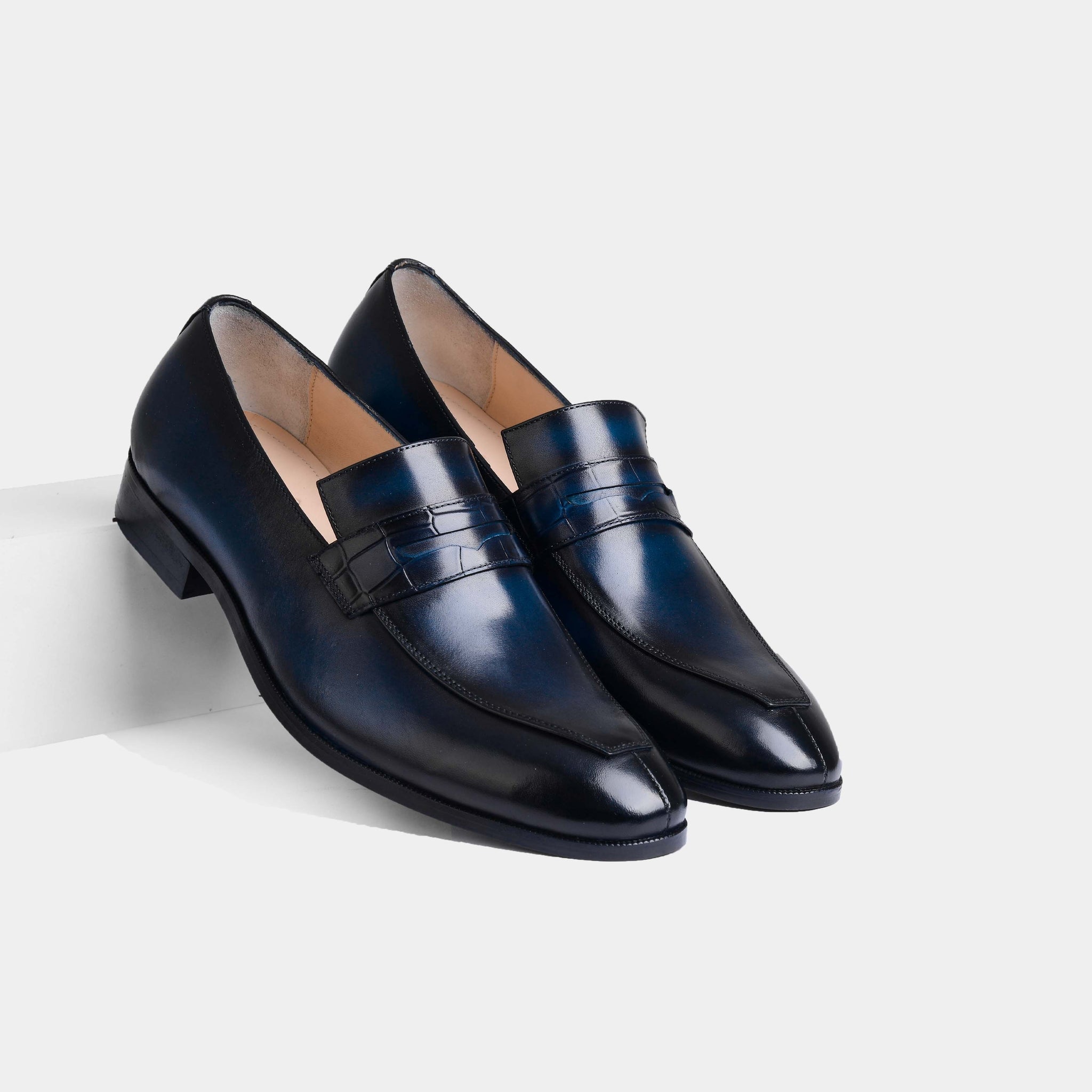 Pair of Lucero Blue Leather Loafers with a subtle crocodile-embossed strap across the vamp.