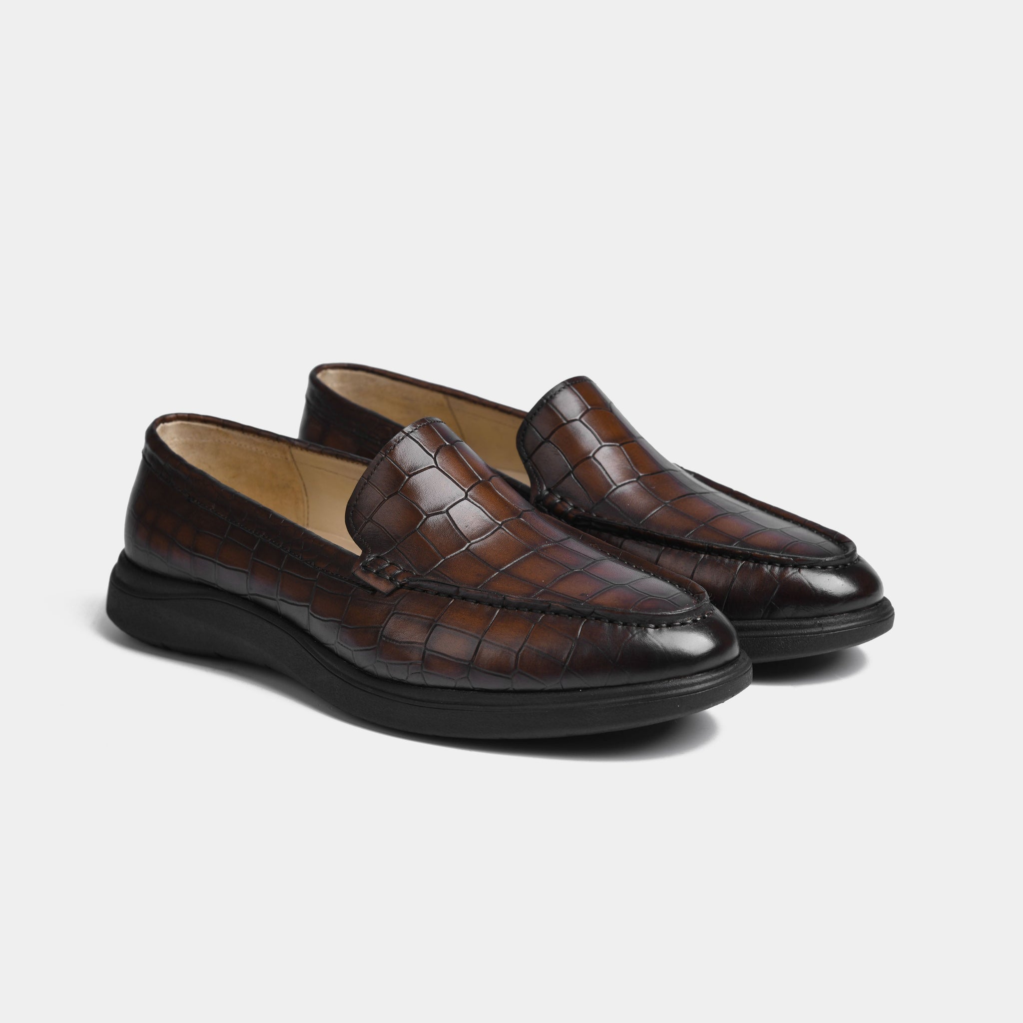 Pair of brown crocodile-embossed leather slip-on Aero-Flex shoes with a comfortable, flexible sole.