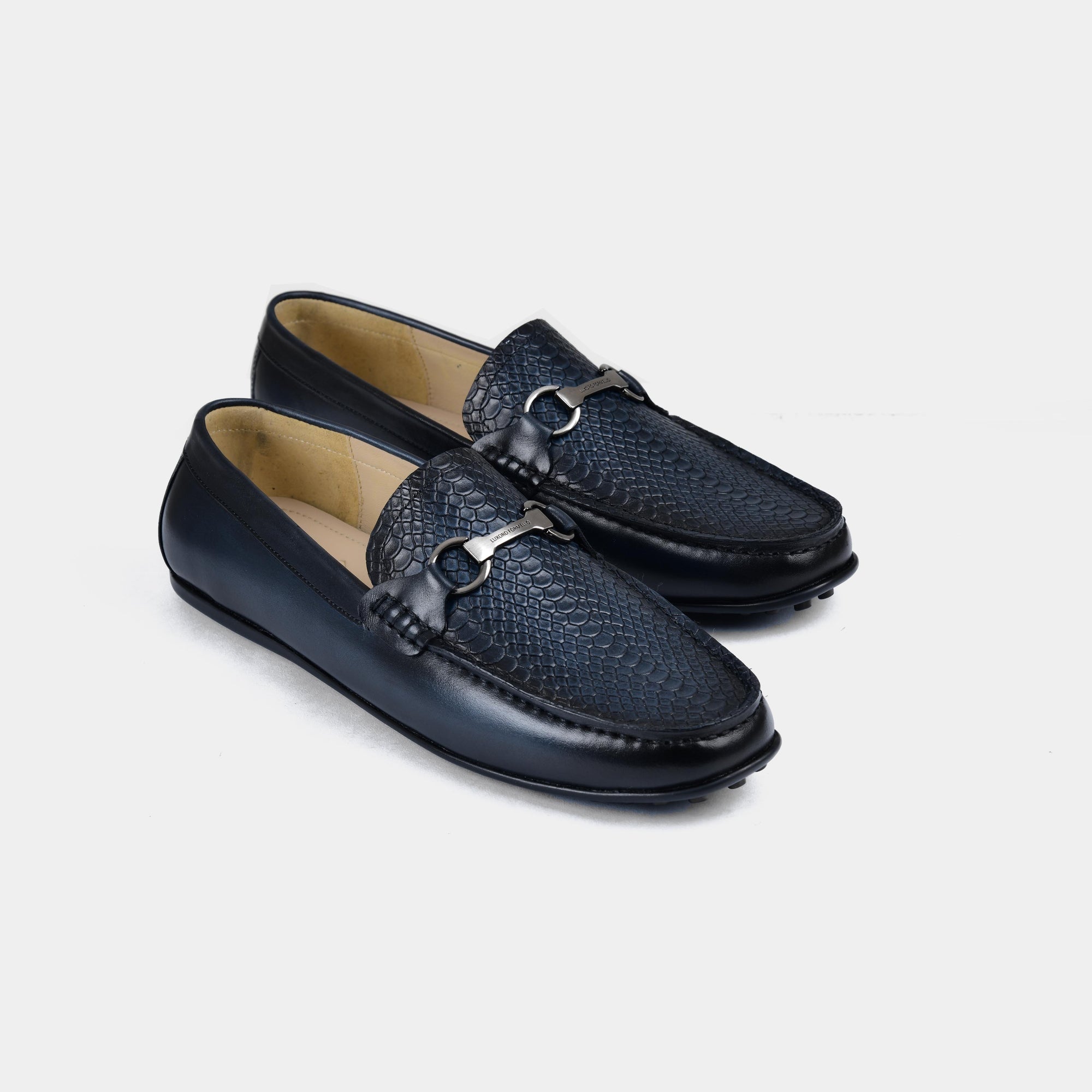 Pair of Matias Blue Leather Driving Loafers with a snakeskin texture and silver buckle detail.