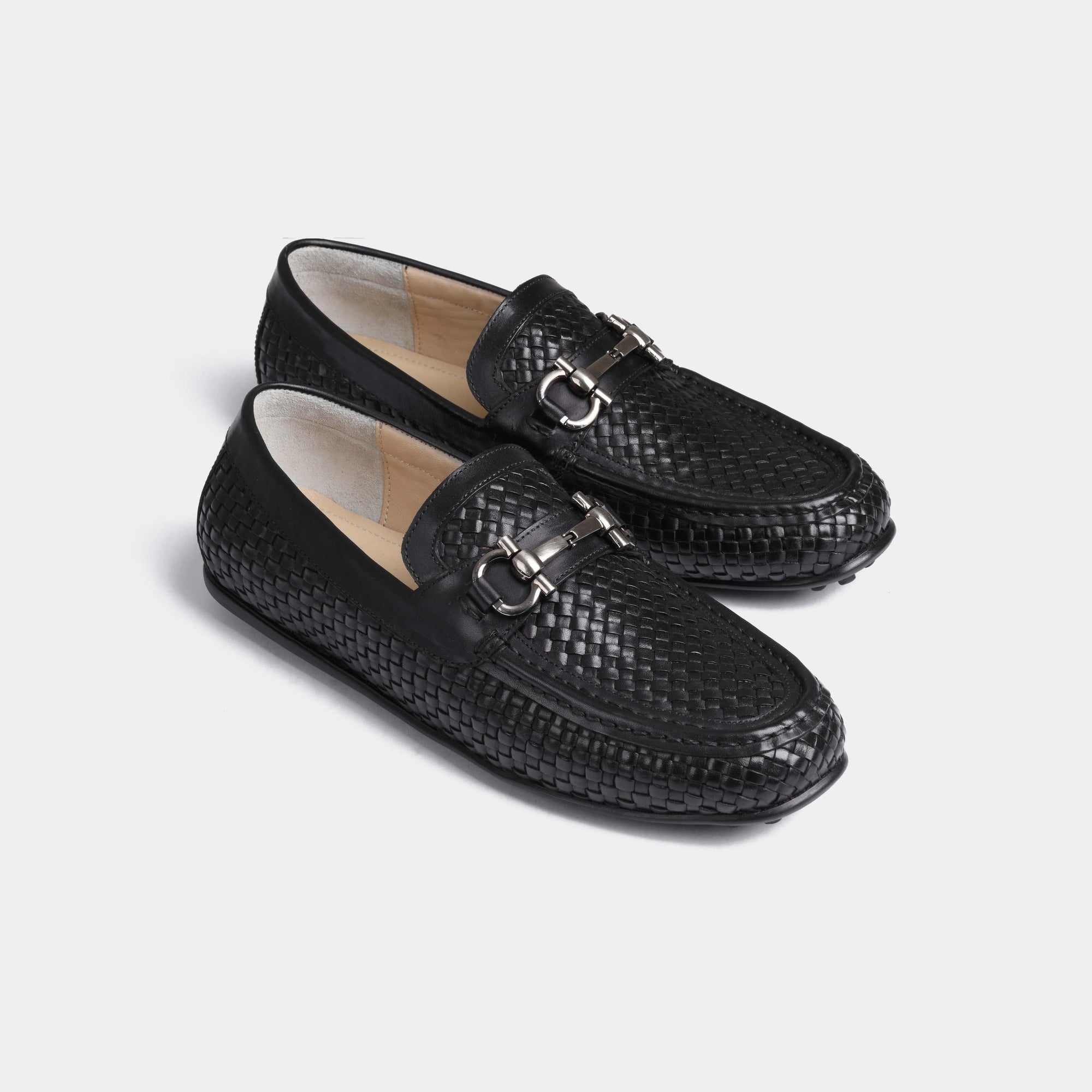 Pair of Lucio Weaved Black Leather Driving Loafers with a woven leather design and silver buckle accent.