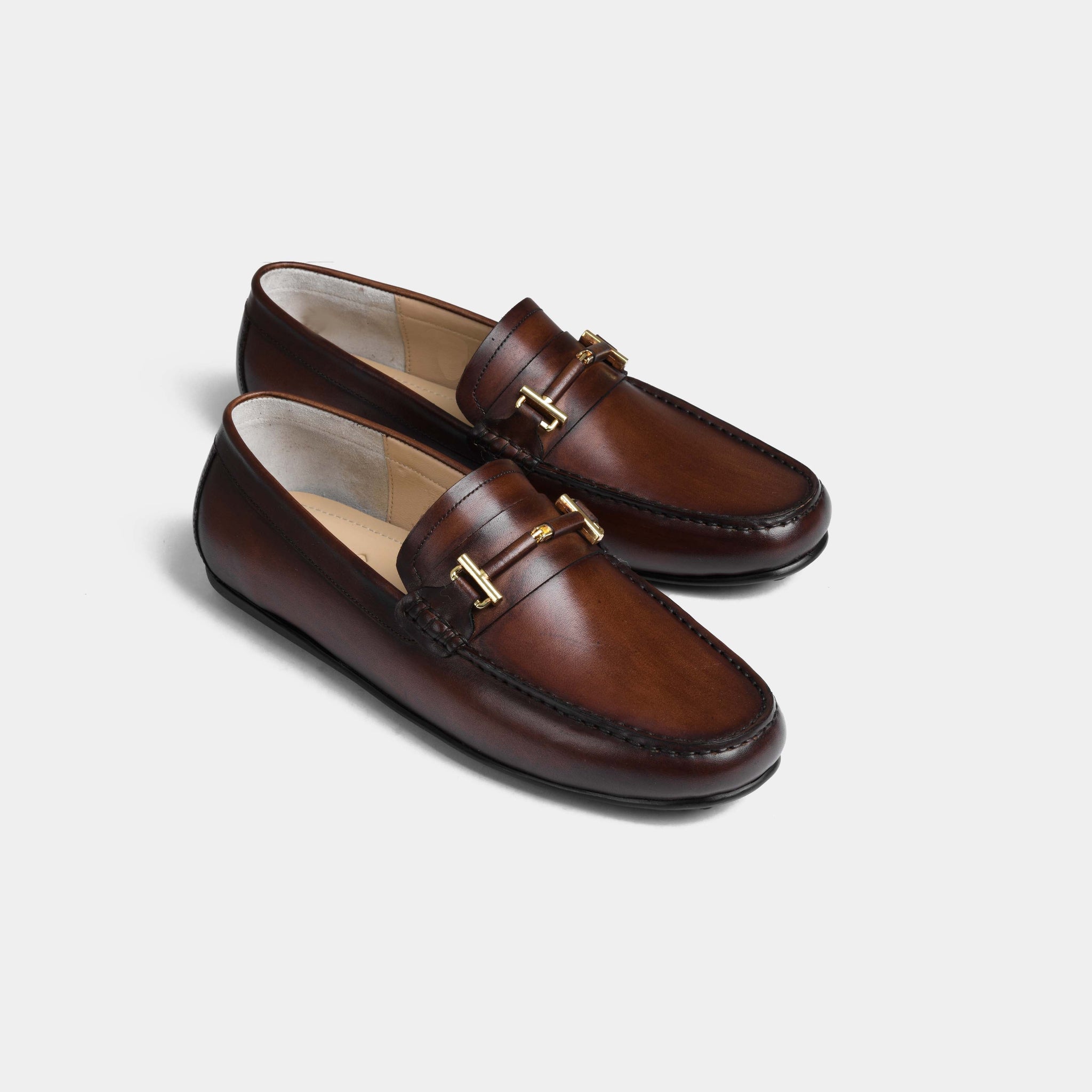 Pair of Diablo Brown Leather Driving Loafers with gold buckle accent.