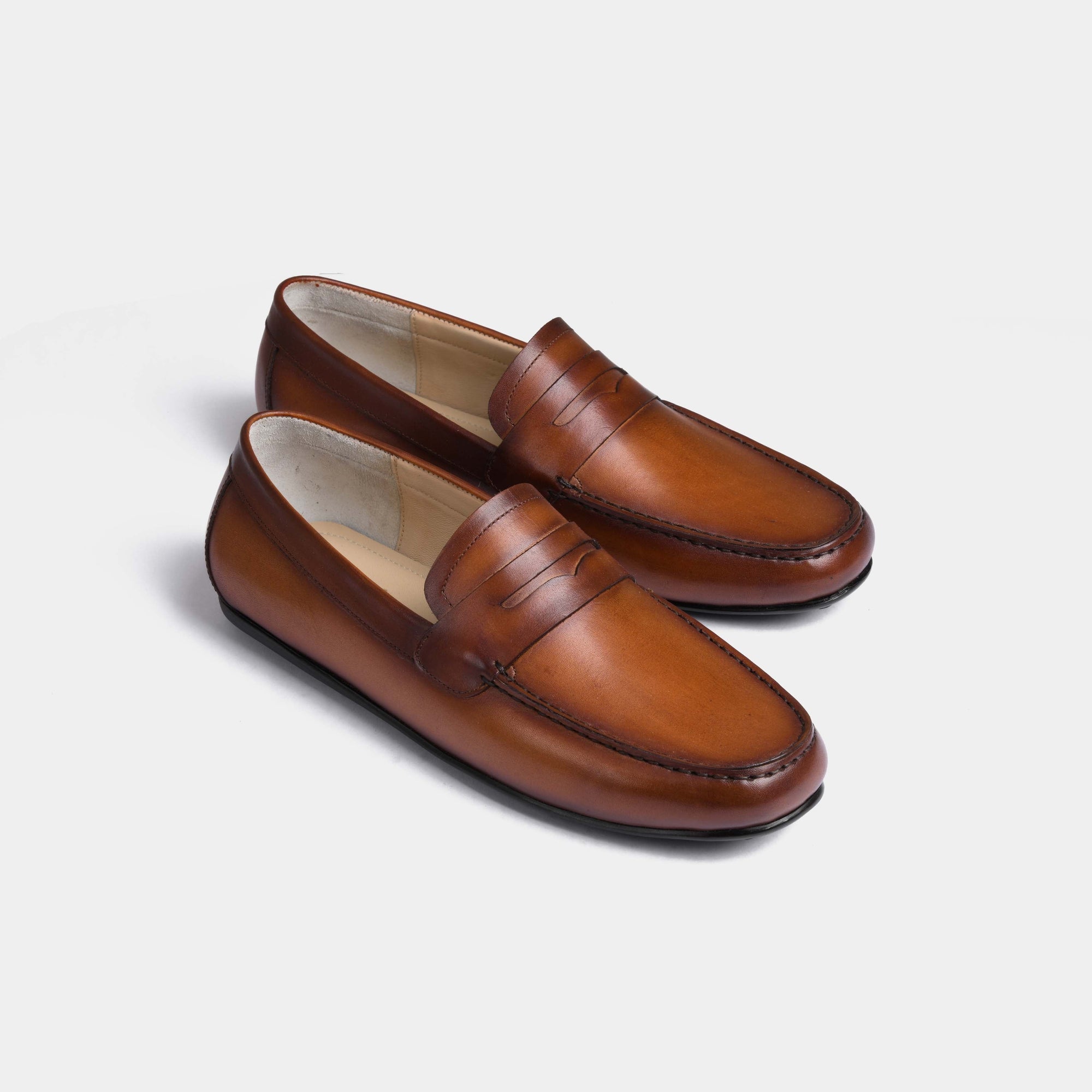 Pair of Javier Tan Leather Driving Loafers in tan, showcasing their classic design and rich leather.