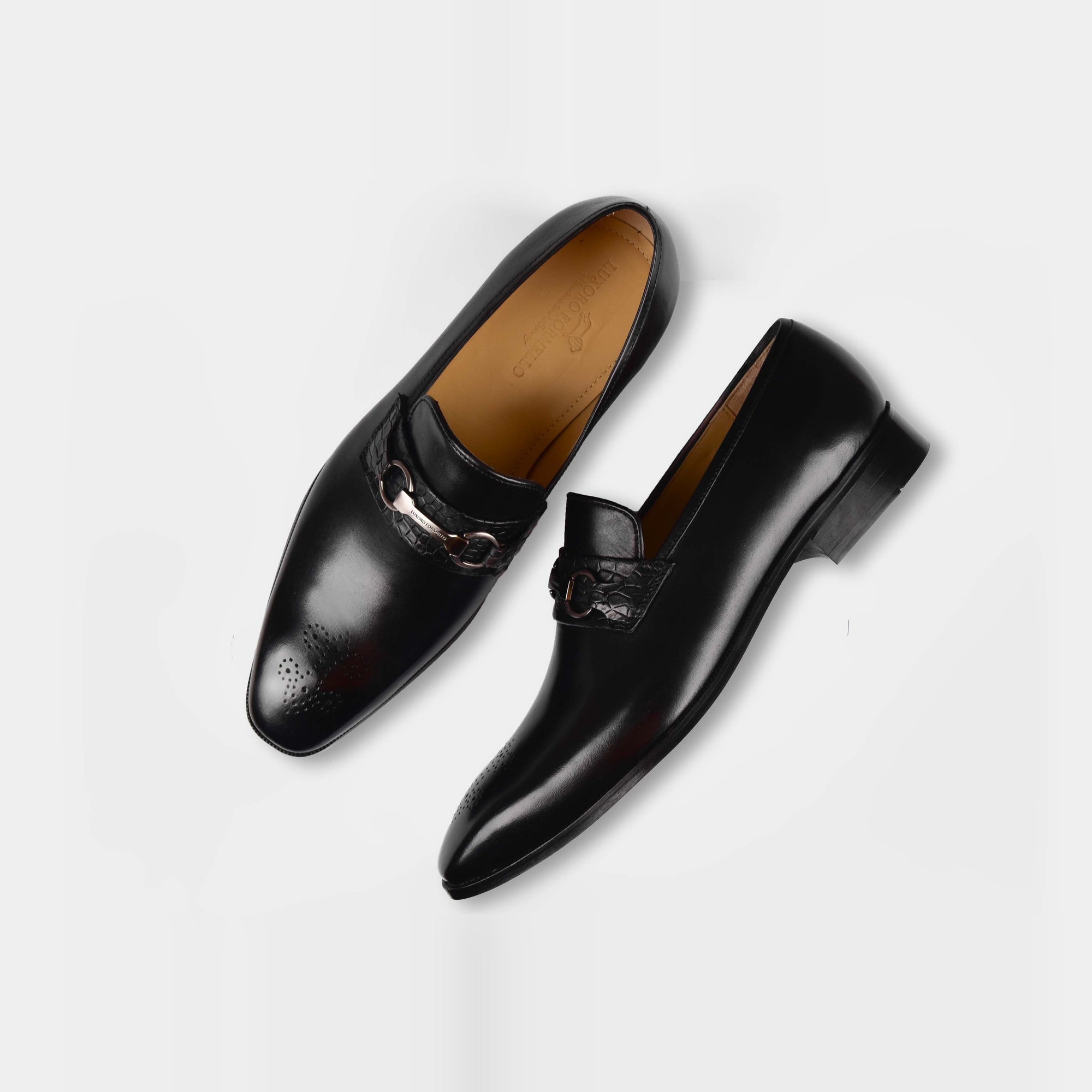 Pair of Diaz Black Loafers with a silver buckle detail on top.