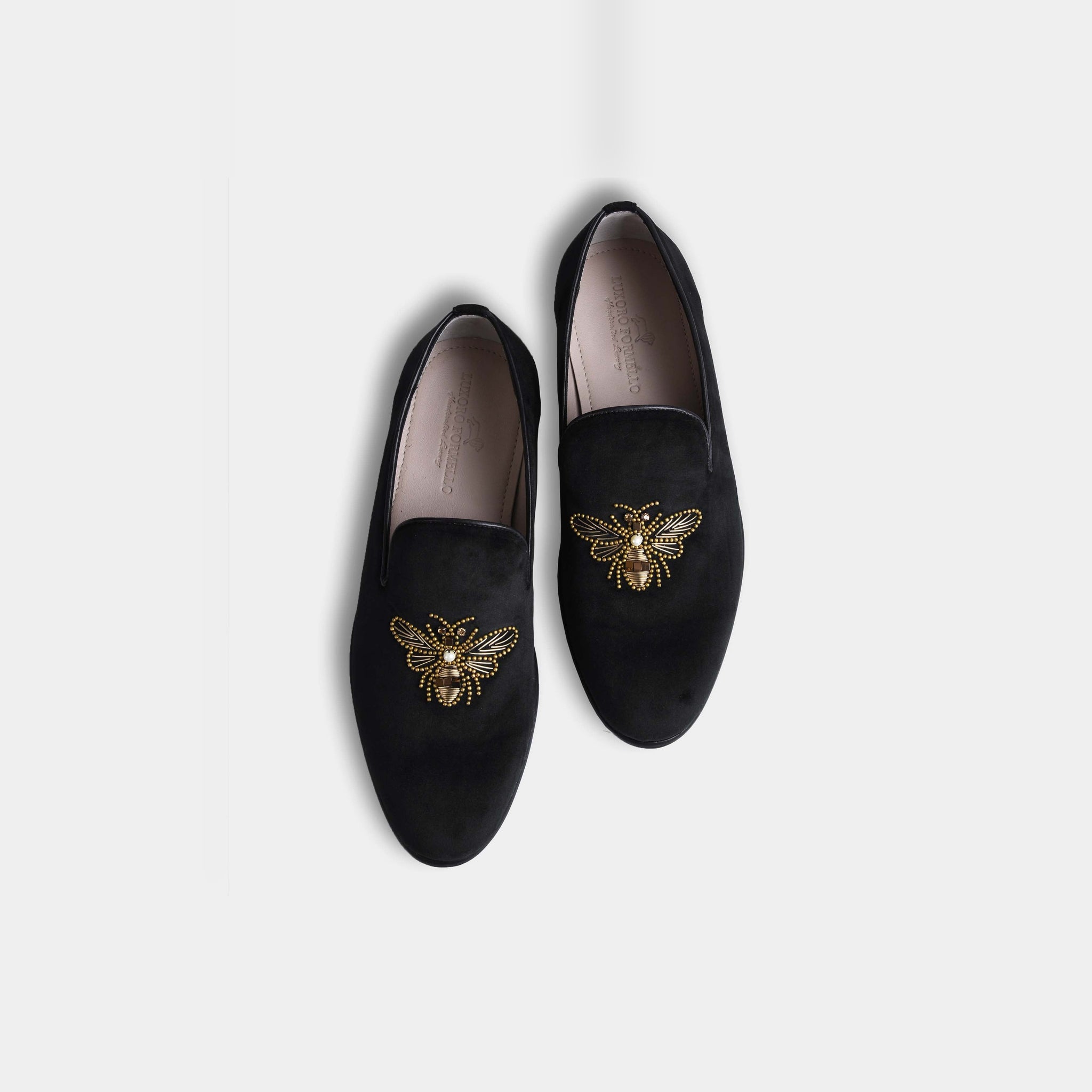 Pair of Amado Black Embroidered Leather Slip-Ons with gold bee embroidery, viewed from above.