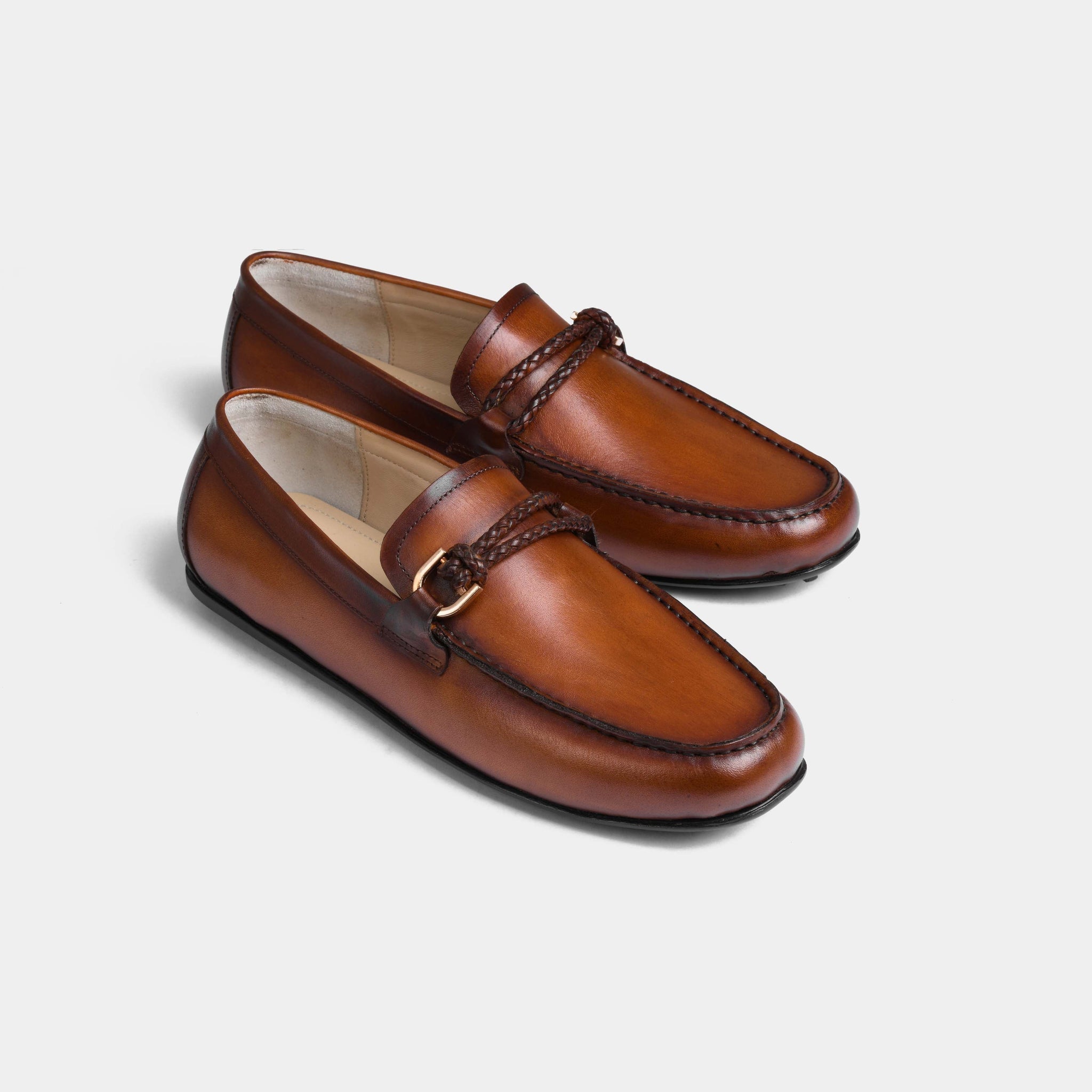 Pair of Pablo Tan Leather Driving Loafers with braided strap and metal buckle detail.