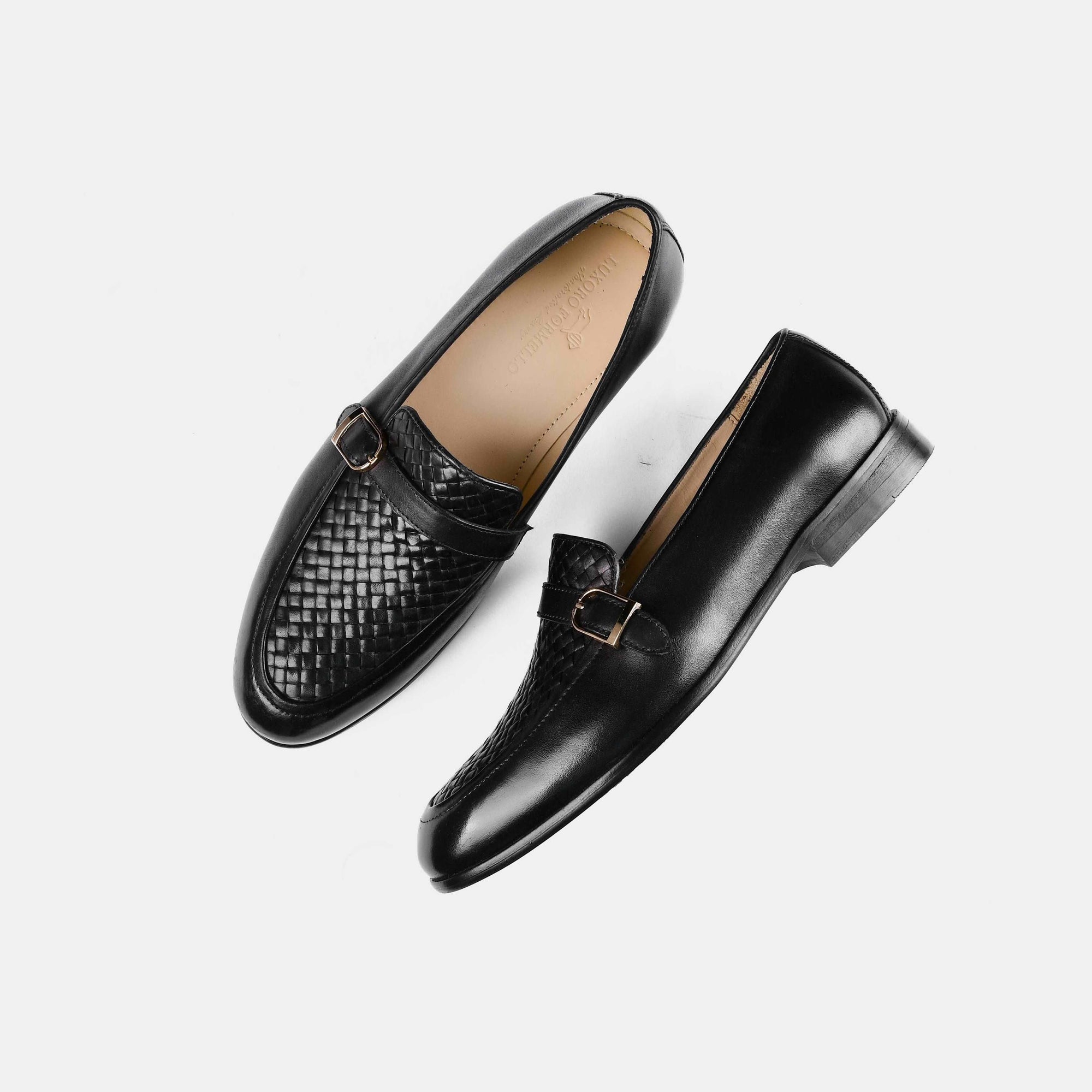 A pair of Arlow Black Weaved Buckle Leather Loafers on a white background.