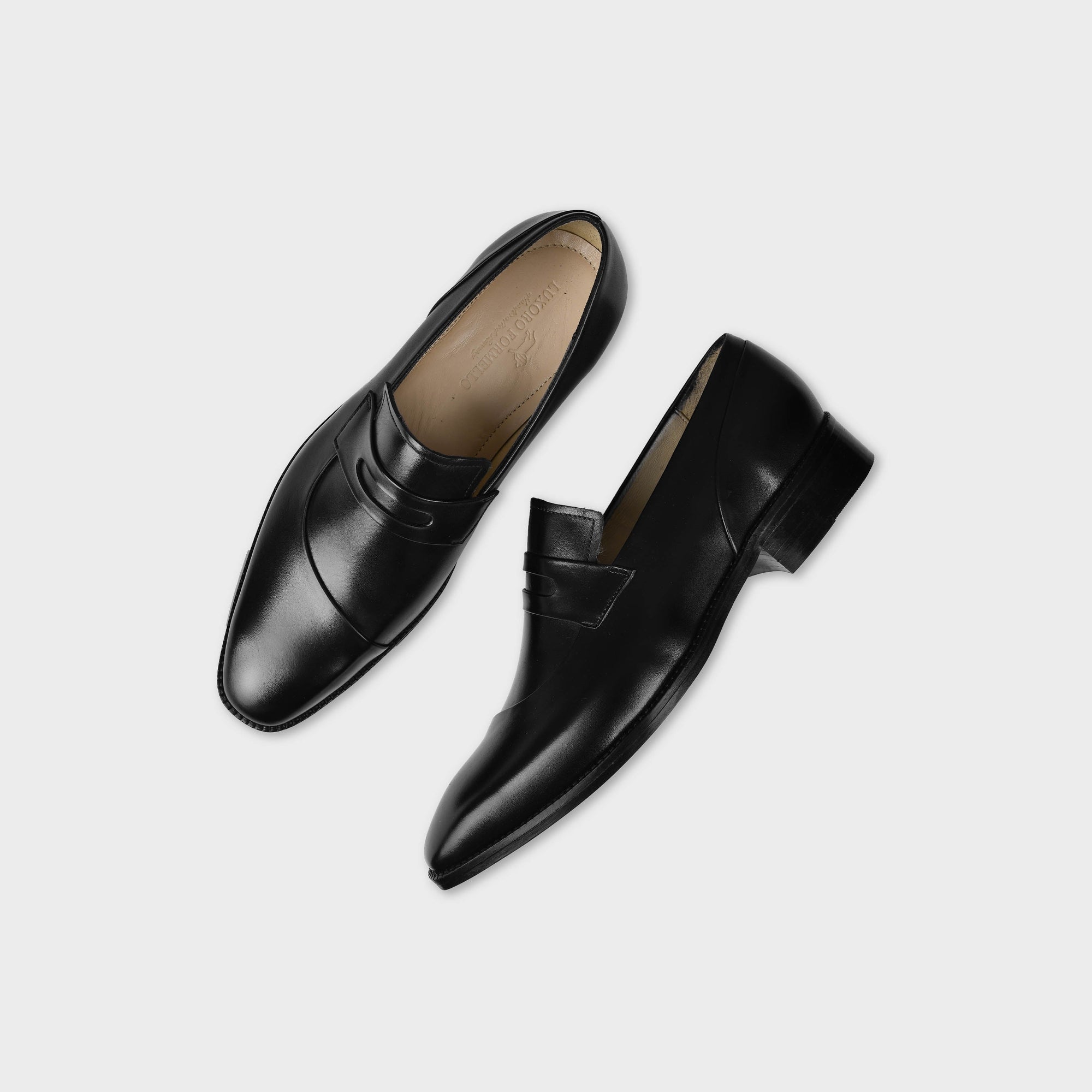 Pair of Laredo Black Leather Loafers with a penny loafer style and a sleek, polished finish.