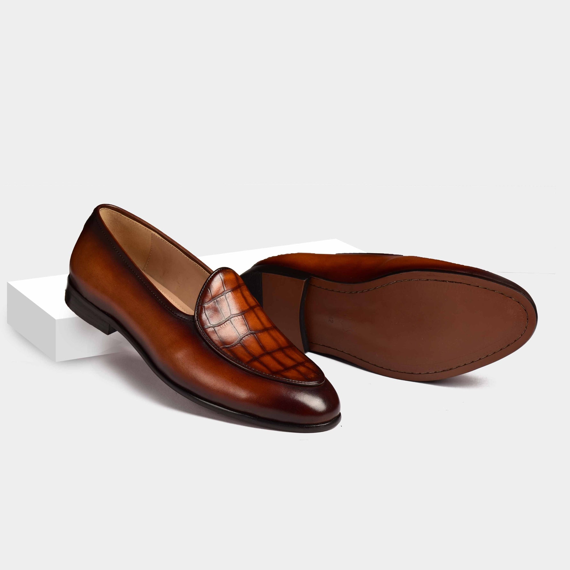 Pair of Arno Loafers in brown patina leather with a textured crocodile-embossed panel.