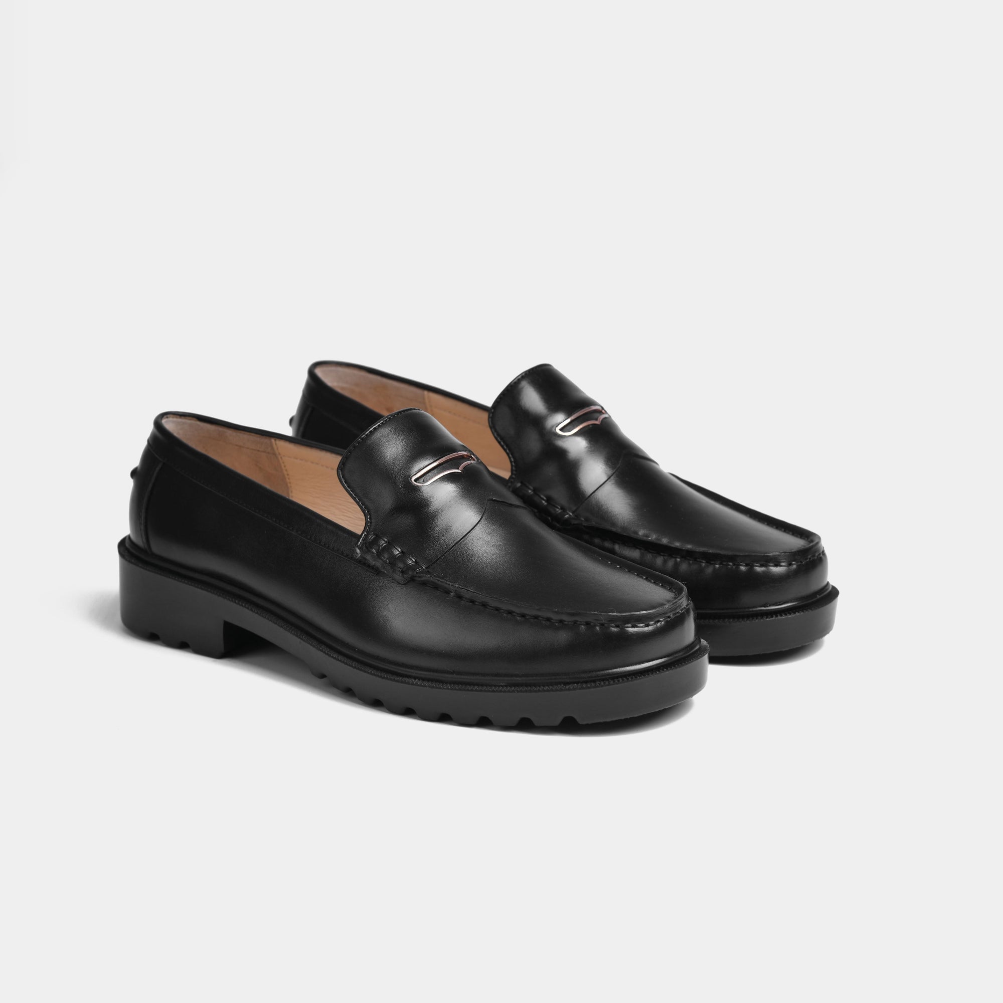 Pair of black leather loafers with Solesculpt Lite technology for a stylish and comfortable fit.