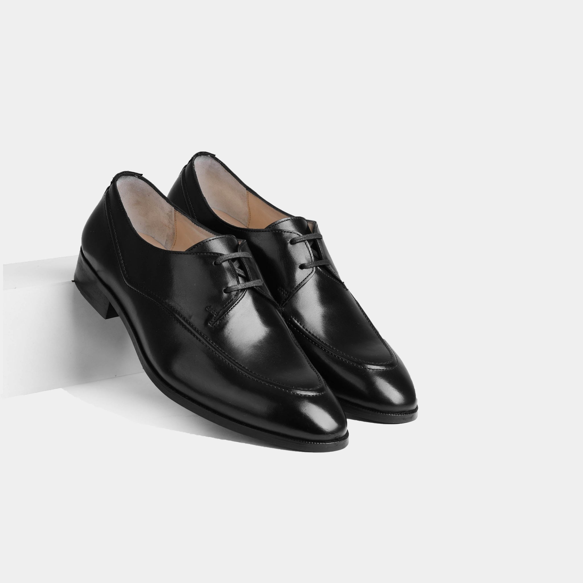 Pair of Marcos Charcoal Lace Ups, sleek black leather dress shoes with a lace-up closure.