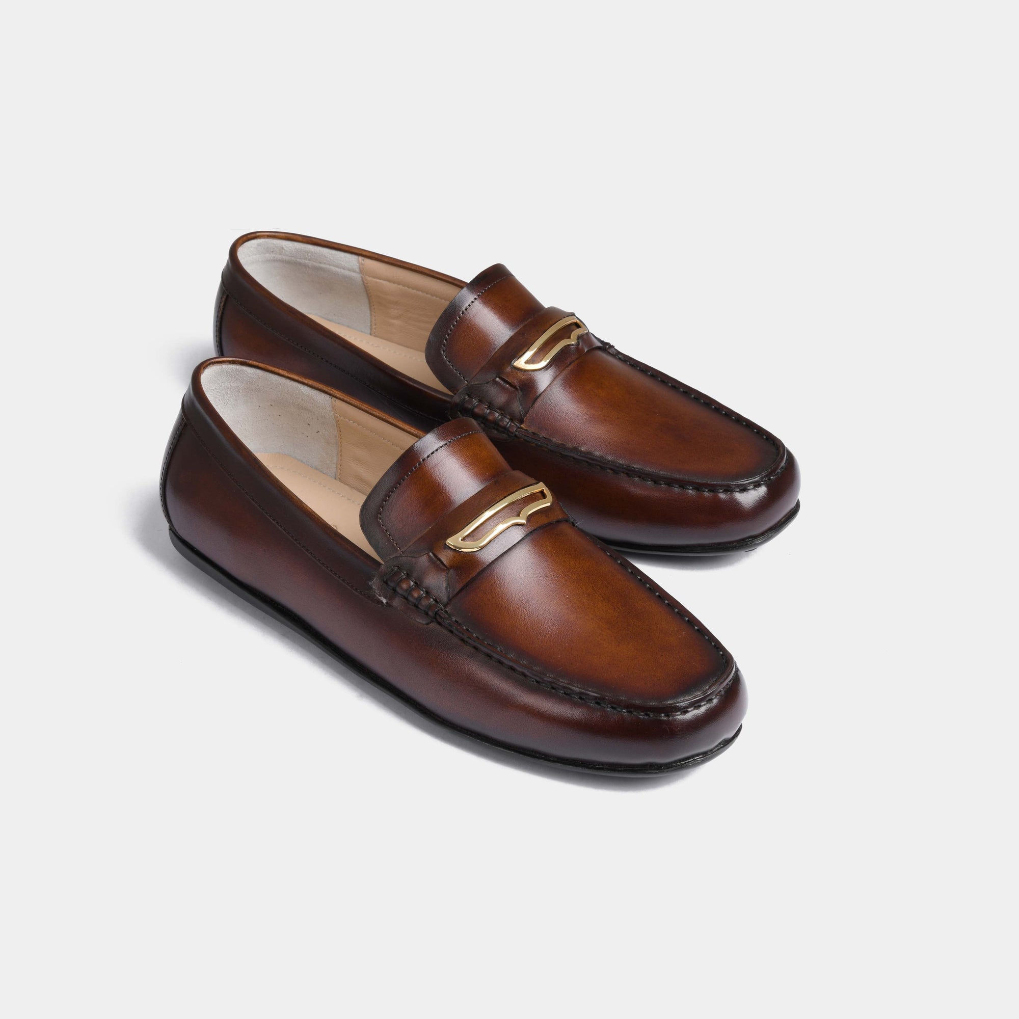 Cruz Brown Leather Driving Loafers with a stylish gold accent.