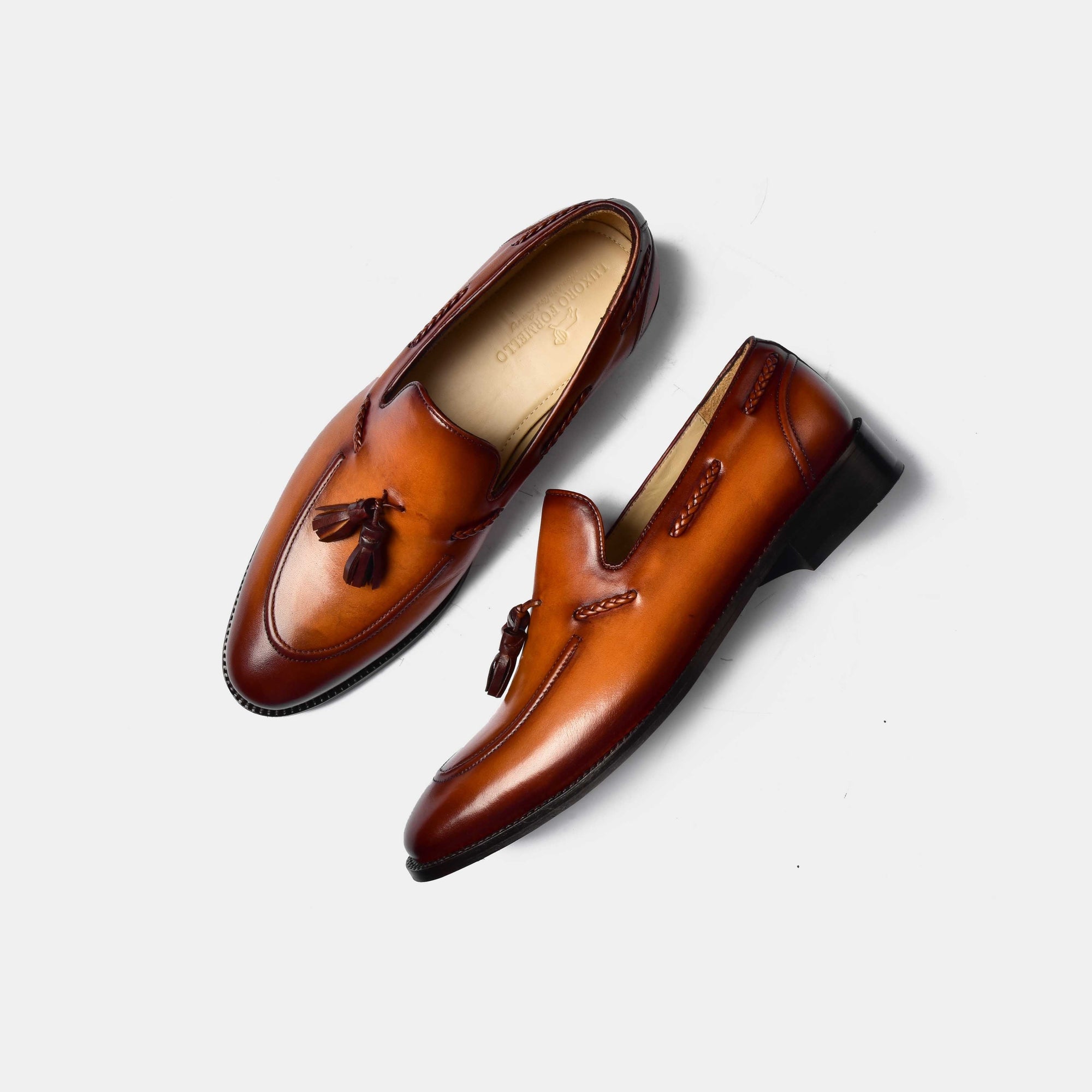 Pair of Wilson Miller Leather Loafers in brown, featuring tassel accents and a polished finish.