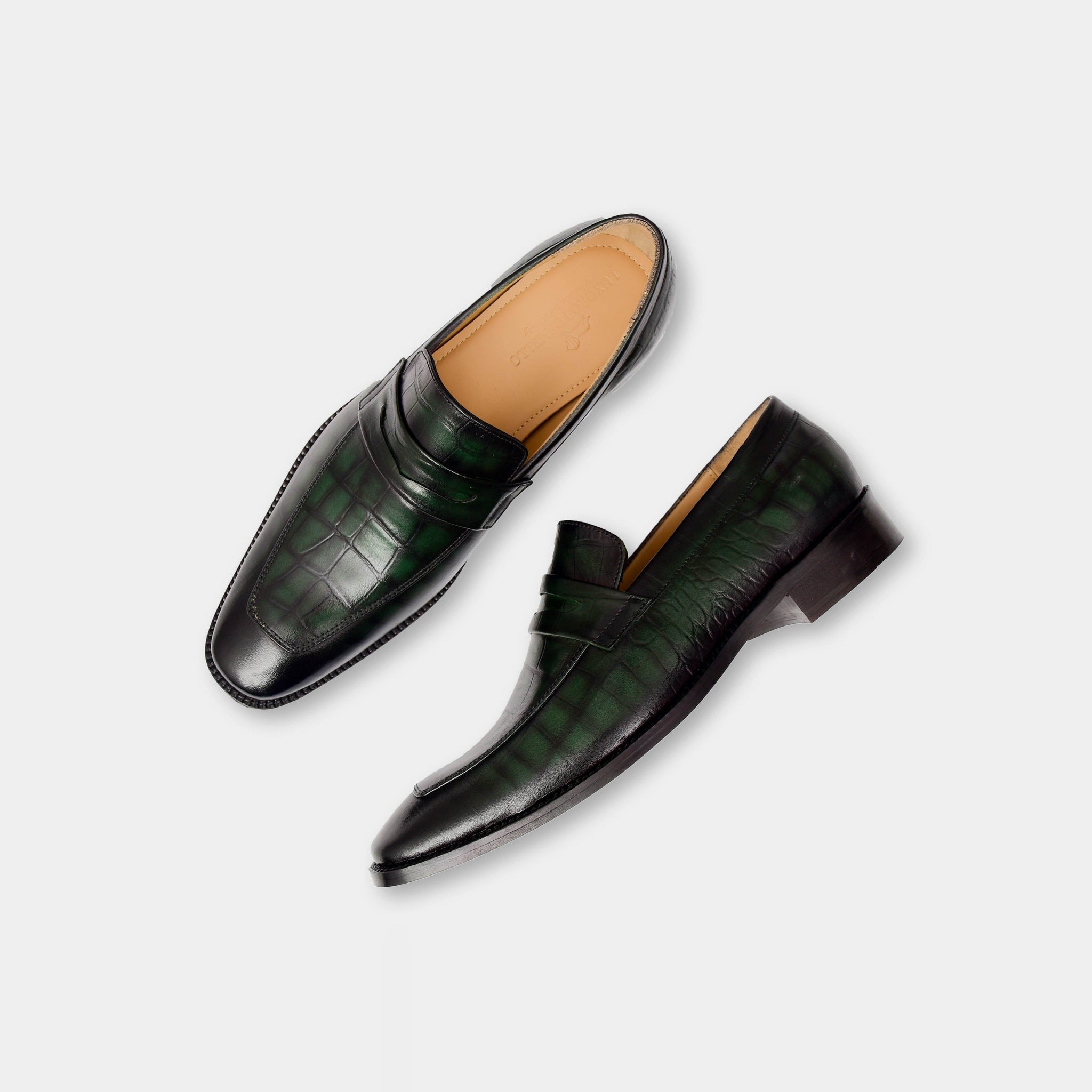 Pair of Arthur Hertz Leather Loafers in green, showcasing their stylish crocodile-embossed leather uppers.