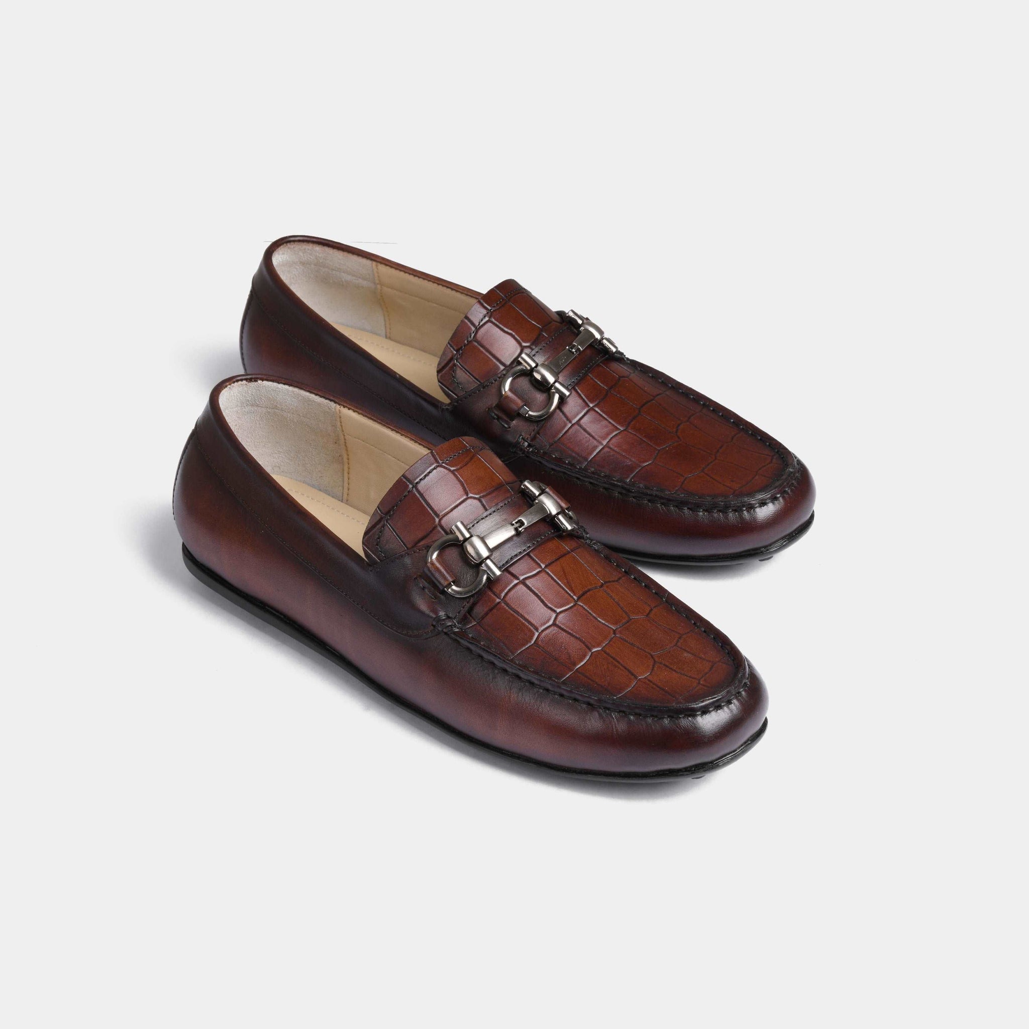 Pair of Alonzo Mid-Brown Leather Driving Loafers with a stylish metal accent on the vamp.