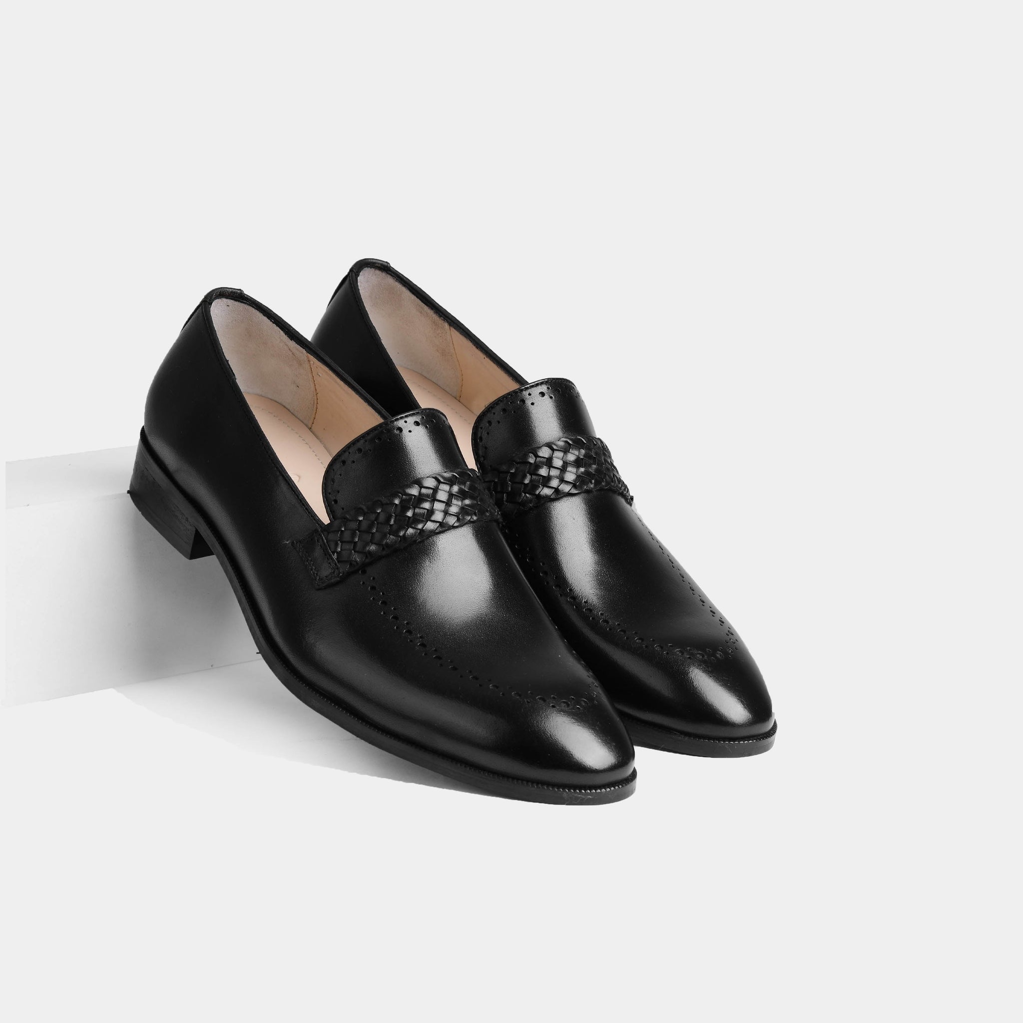 Pair of Alford Black Leather Loafers with woven strap detail, showcasing their sleek and polished design.