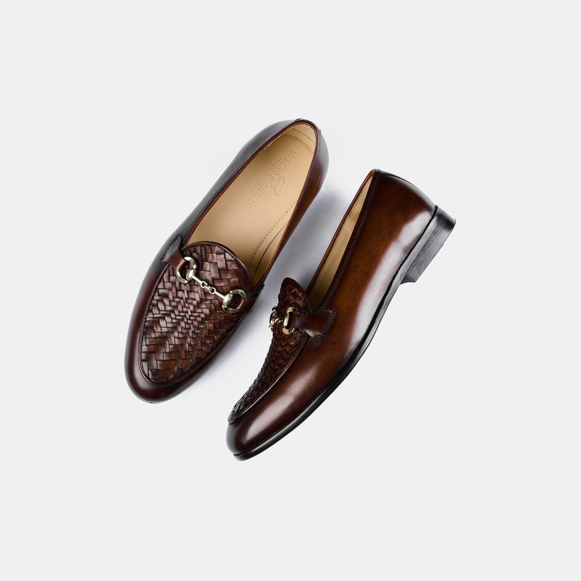 Pair of Santiago Weaved Brown Leather Loafers with woven detail and gold buckle accent, shown from above on a white background.