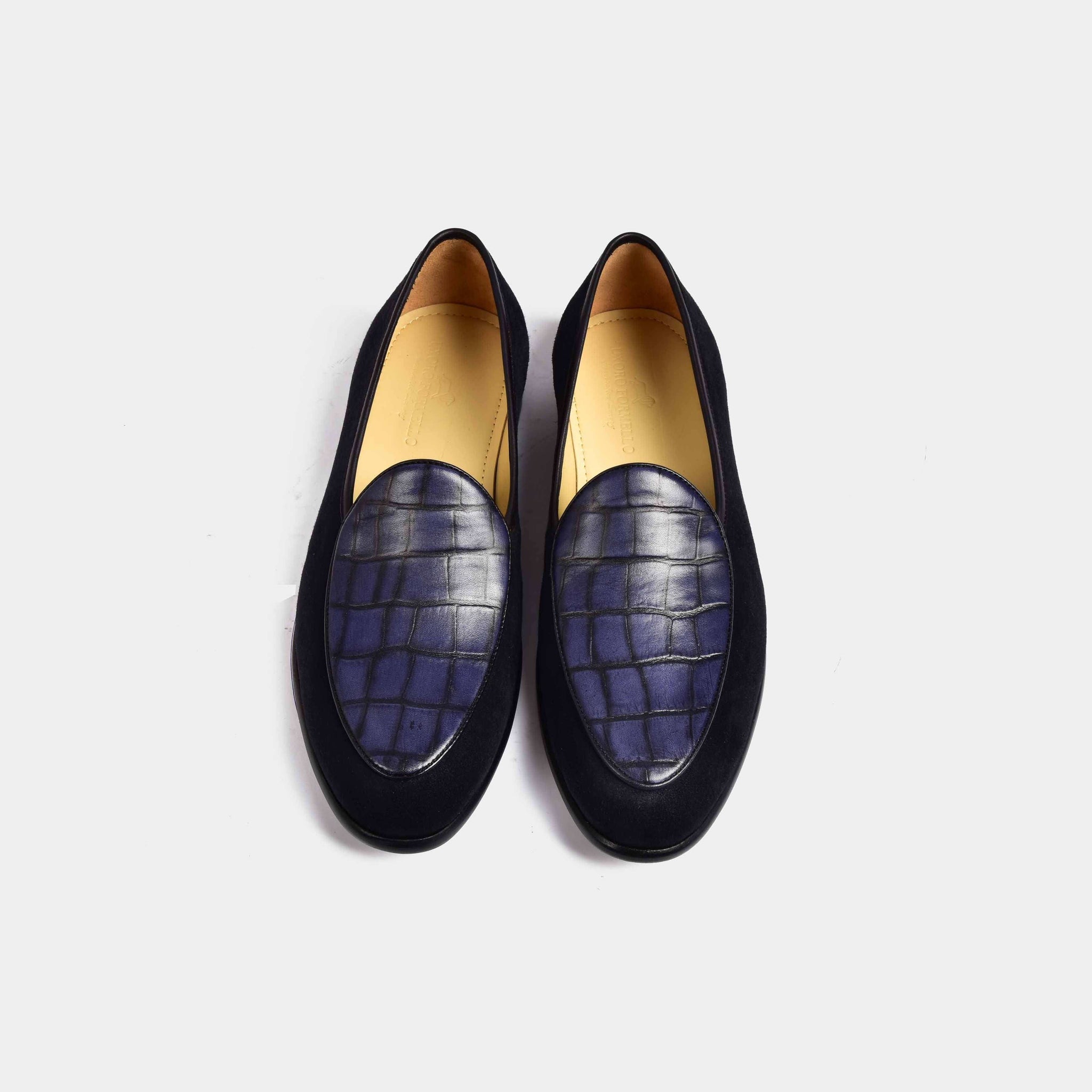 Pair of Arno Loafers in navy blue suede, featuring a textured blue leather vamp.