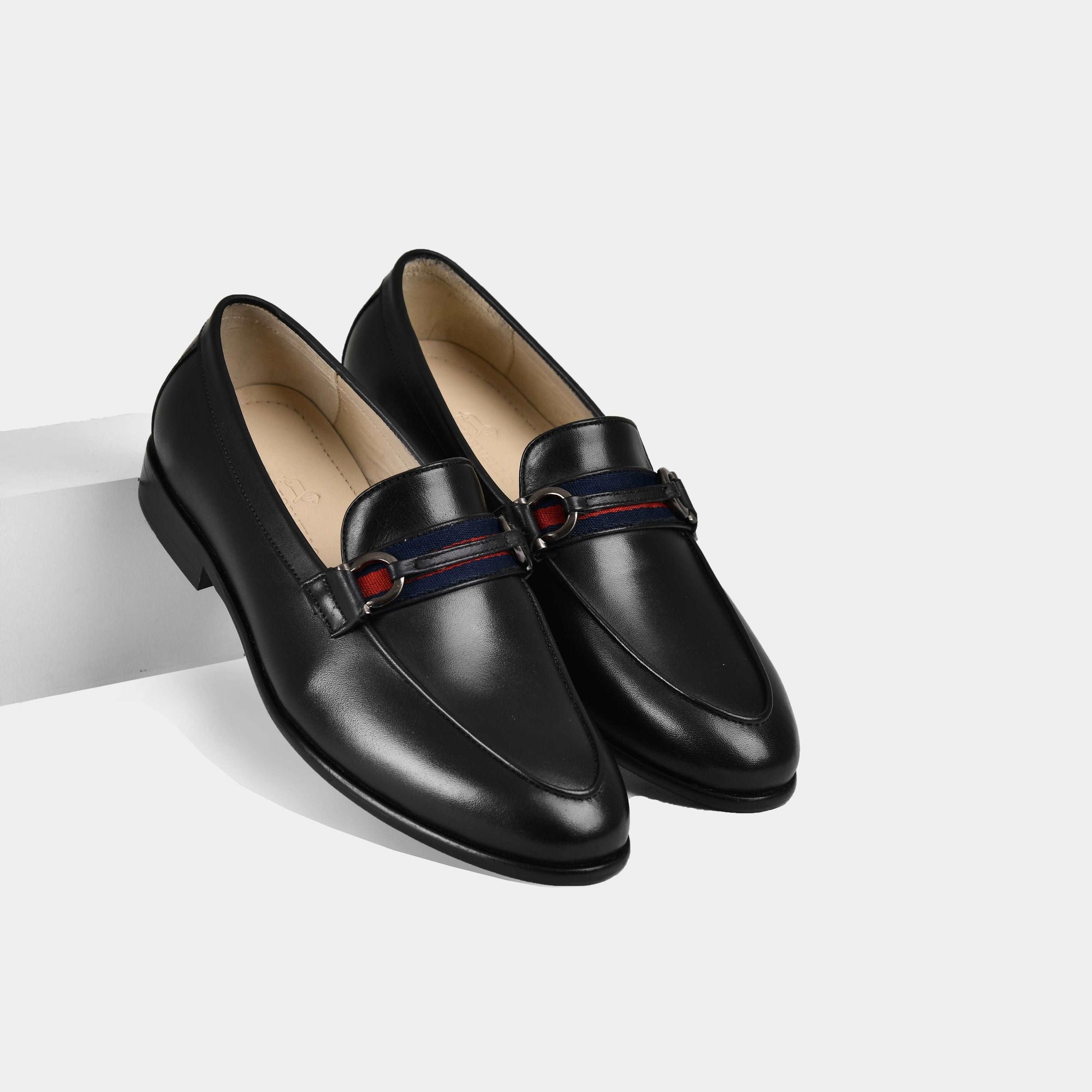 A pair of Armante Black Leather Loafers with a red, white and blue fabric strap detail across the vamp.