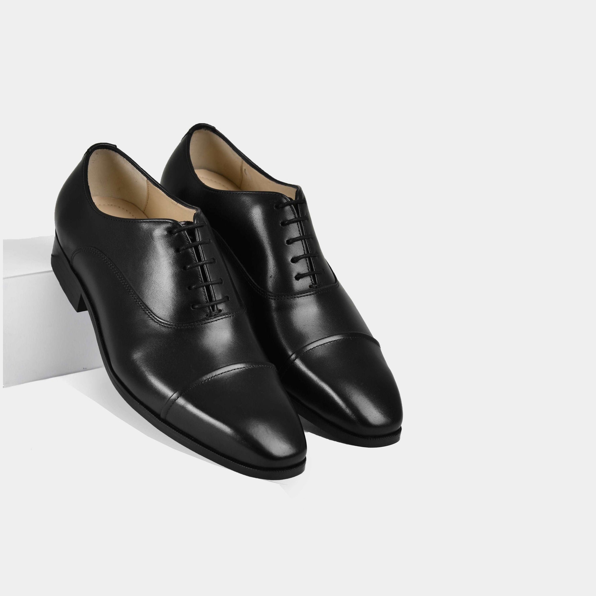 Pair of Arcen Black Leather Laceups dress shoes with a cap toe.