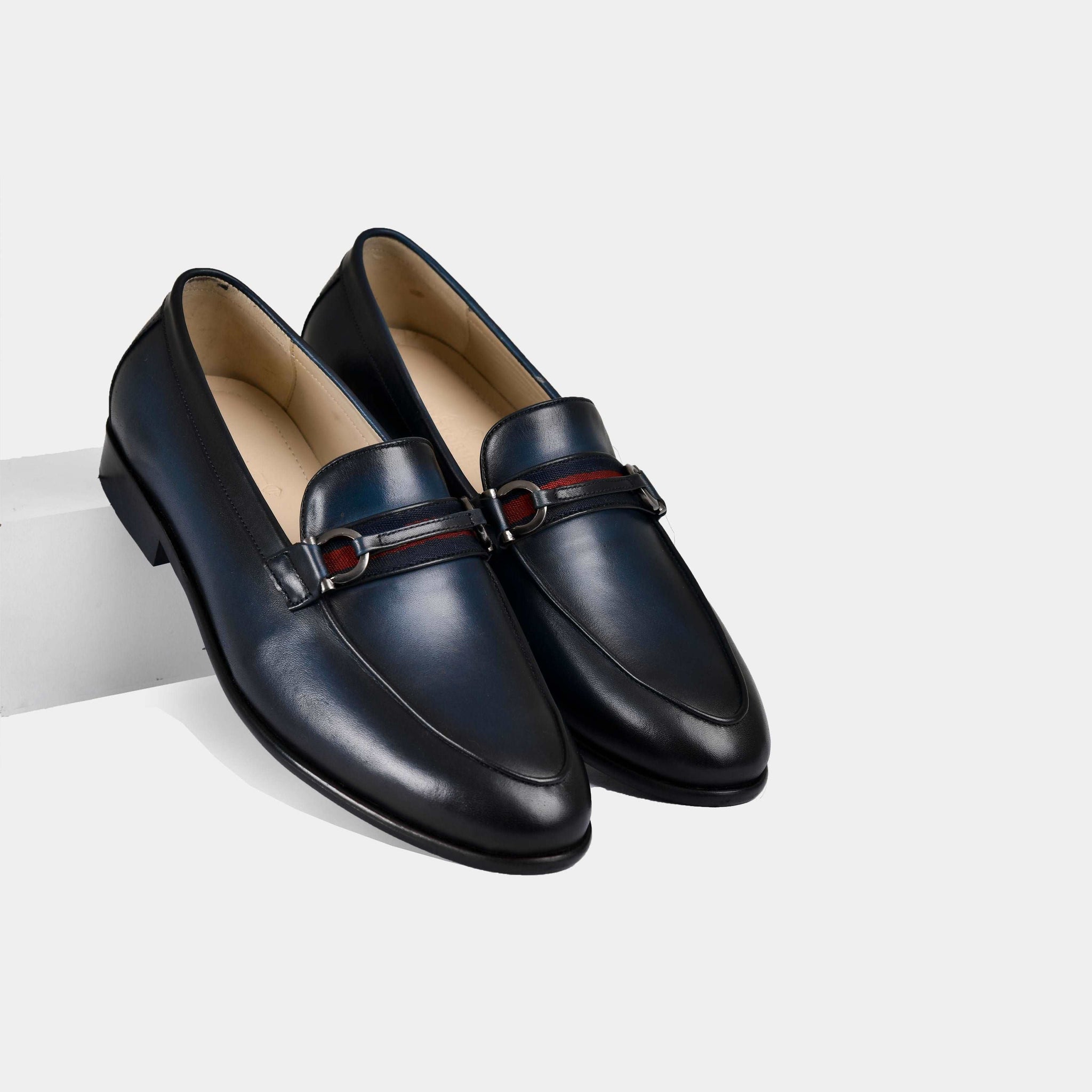 Armante | Blue Leather Loafers with a navy, red, and white strap detail.