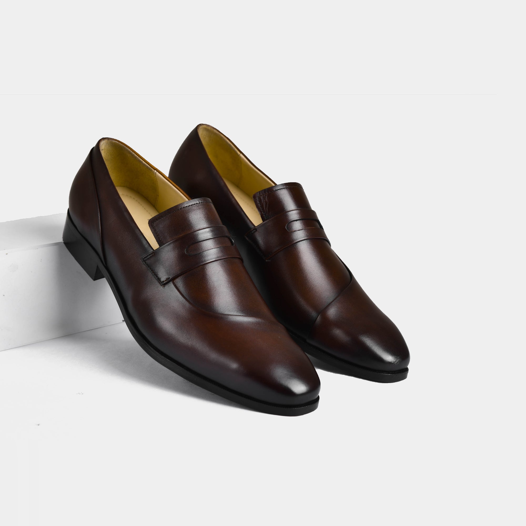 Pair of Laredo Brown Leather Loafers on a white background.