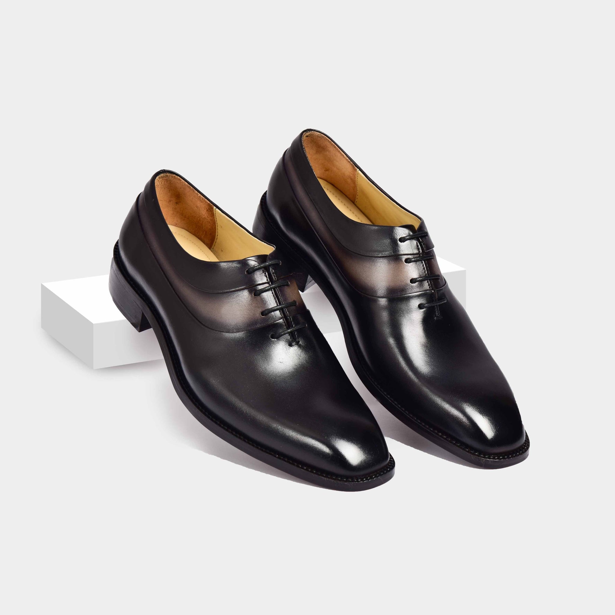 Pair of Arlo Noir Leather Laceups, sleek black dress shoes with a polished finish and classic lace-up closure.