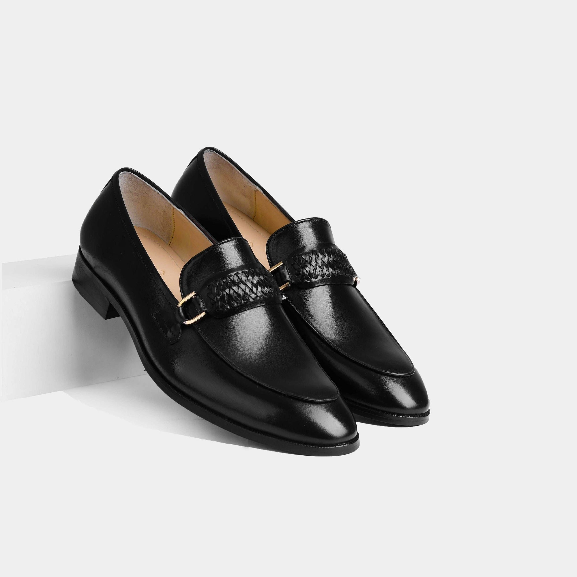 Pair of Cesar Black Leather Loafers with woven strap and gold buckle detail.